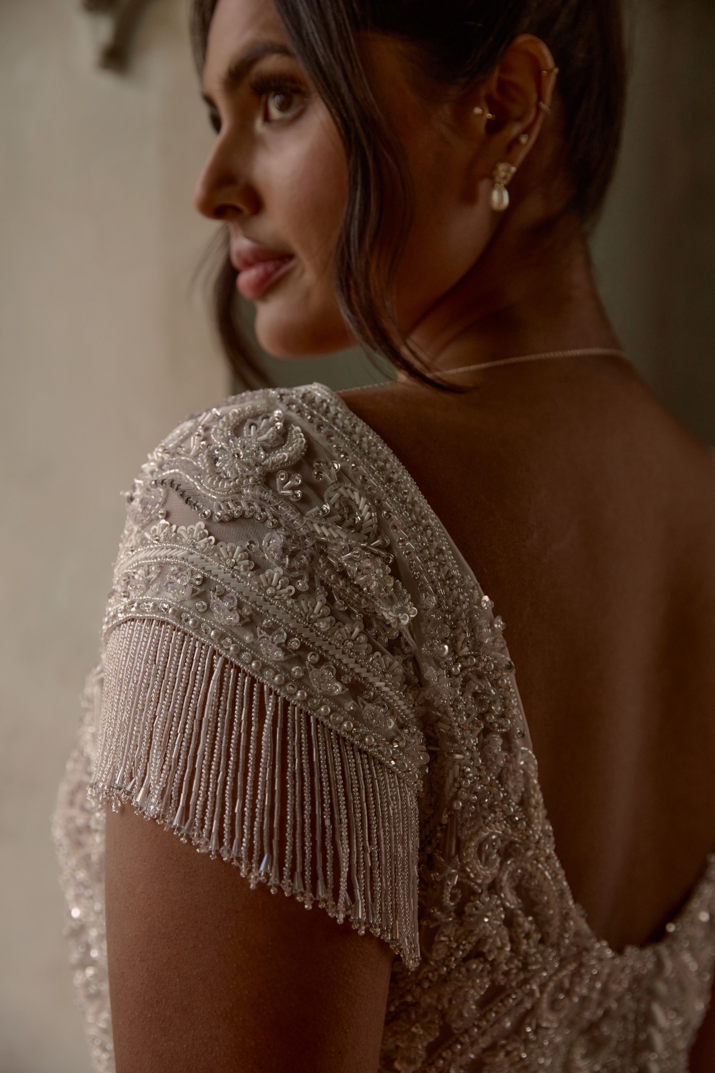 A signature low V-back gives the Mascha topper a modern edge, perfectly balancing its vintage-inspired hand-beading.