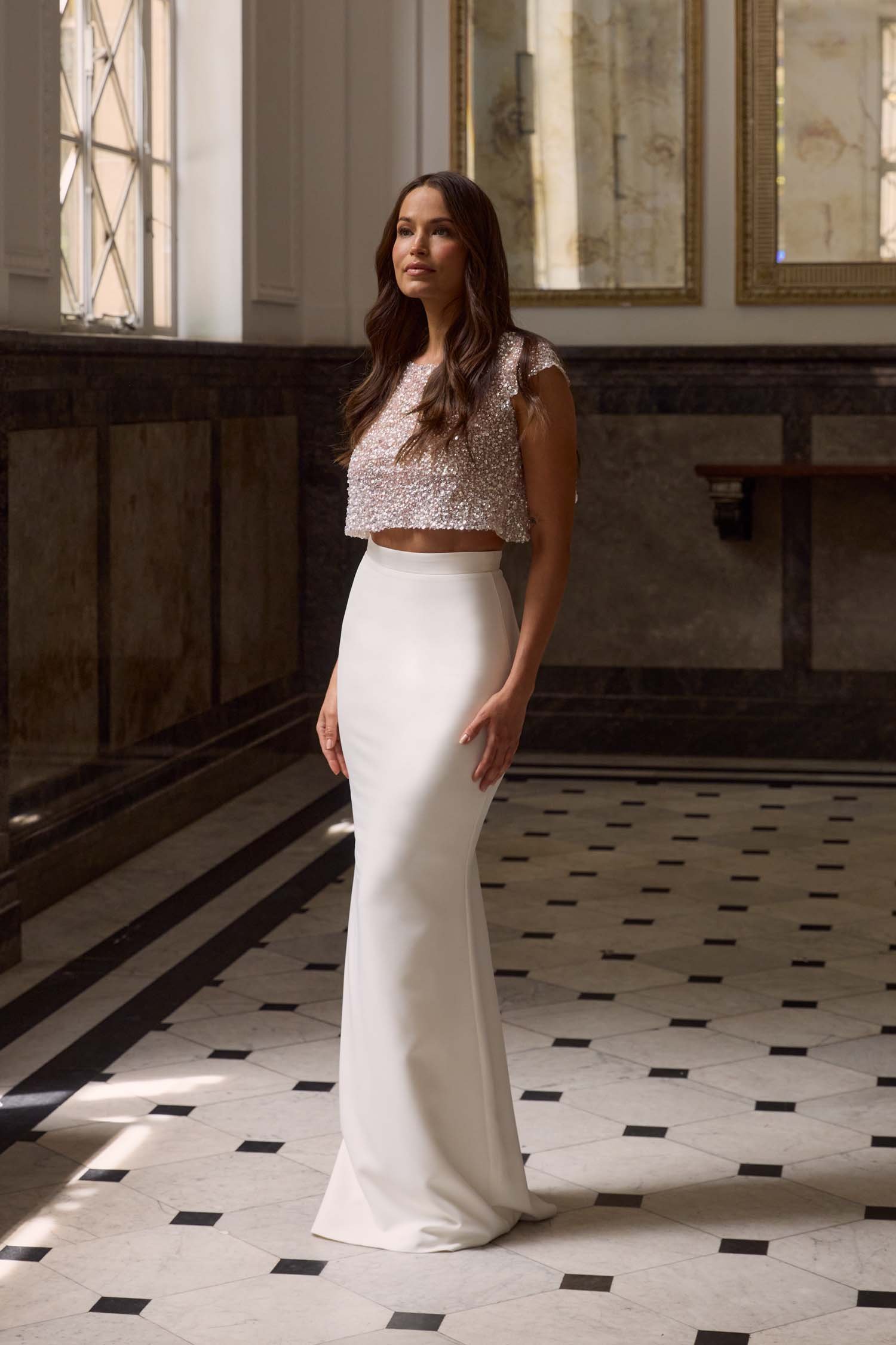 Simplicity at its finest: The Dominic Skirt enhances natural curves with a sleek, train-free design, ideal for brides seeking understated elegance for their special day.