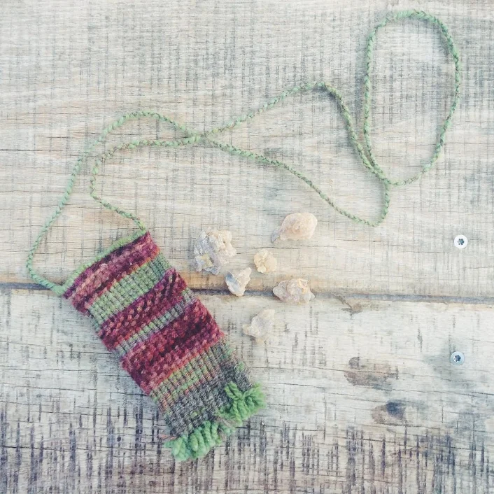 One of the first twined bags, I made for a dear friend, utilizing nettle dyed yarn. Nettle is known for its nutritive and mineralizing qualities and may provide support for those seeking balance, nourishment and stability when worn close to the heart. Circa 2015