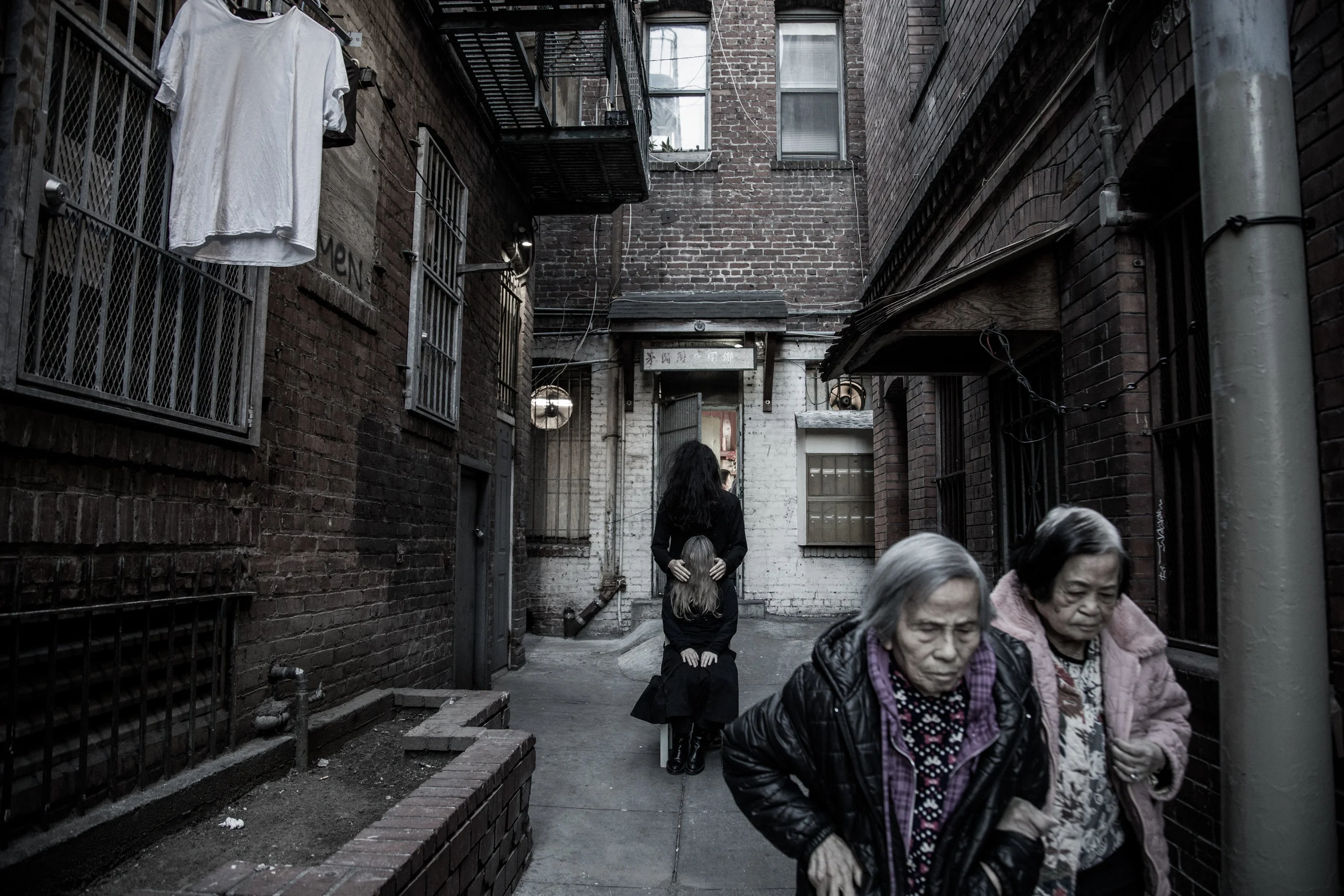 ALEXANDMUSHI, Chair Conversation, Chinatown, 2019, Archival Pigment Print. A collaboration between artists: Alex Nichols & Mushi Wooseong James. The opening reception on Wednesday, April 17th will feature a 30 minute chair conversation with artists ALEXANDMUSHI , who will use a nonverbal language to communicate and learn about each other’s histories.