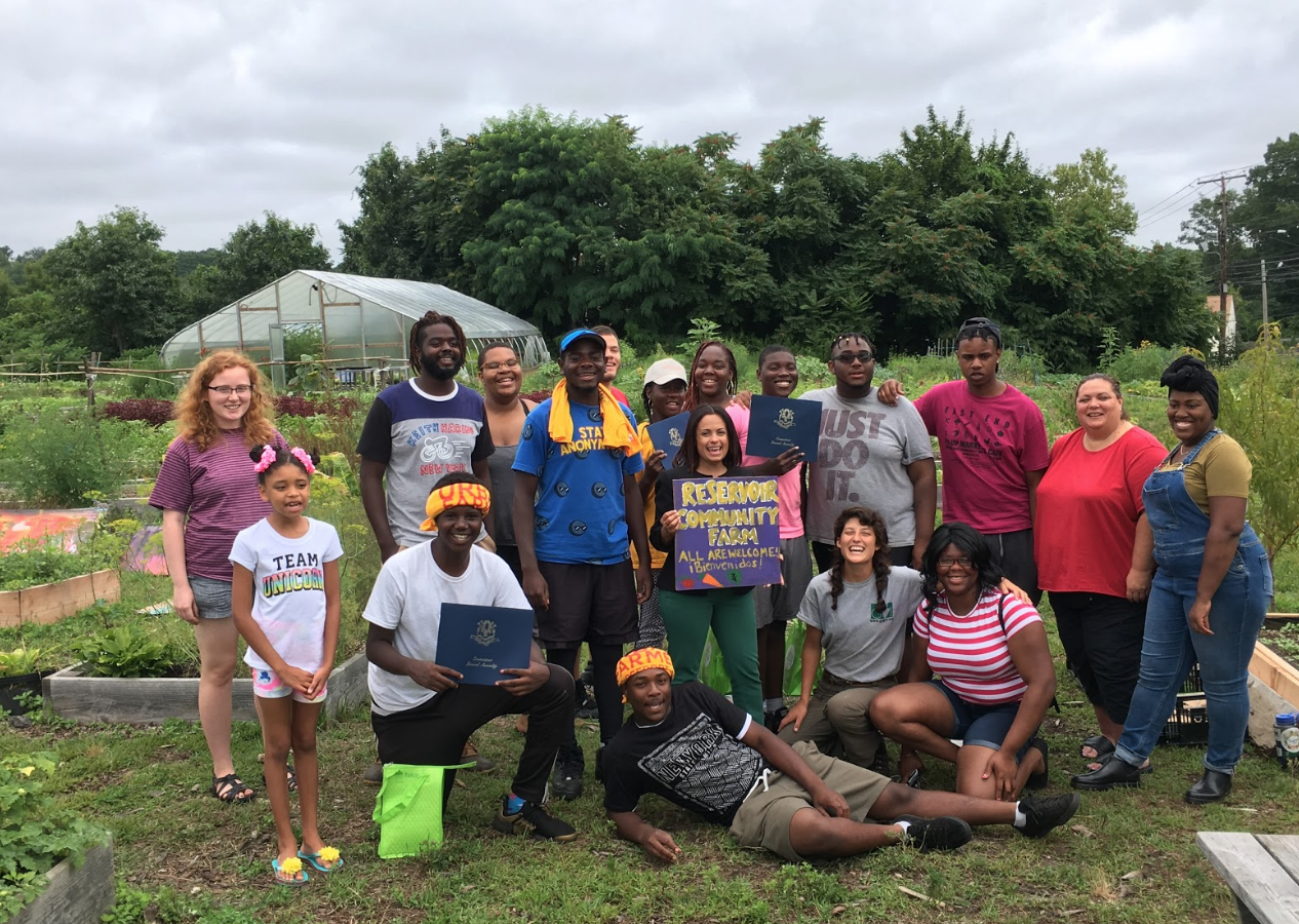 Our 2017 summer Youth Crew along with our Americorps Youth VISTA Rob and Farmer Ellie celebrating at the youth’s graduation ceremony!
