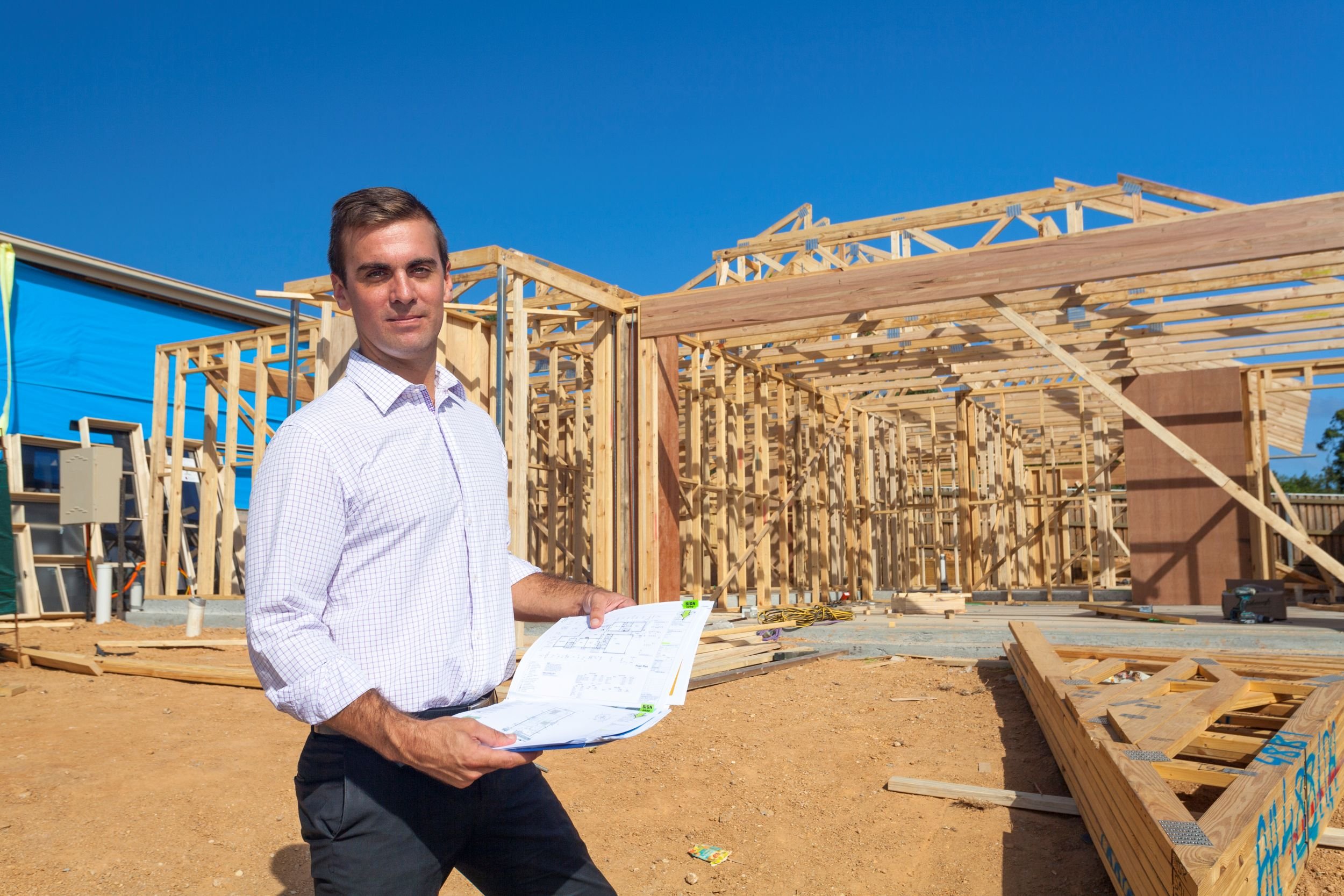 Quantity surveyor inspecting dwelling under construction for bank progress claim