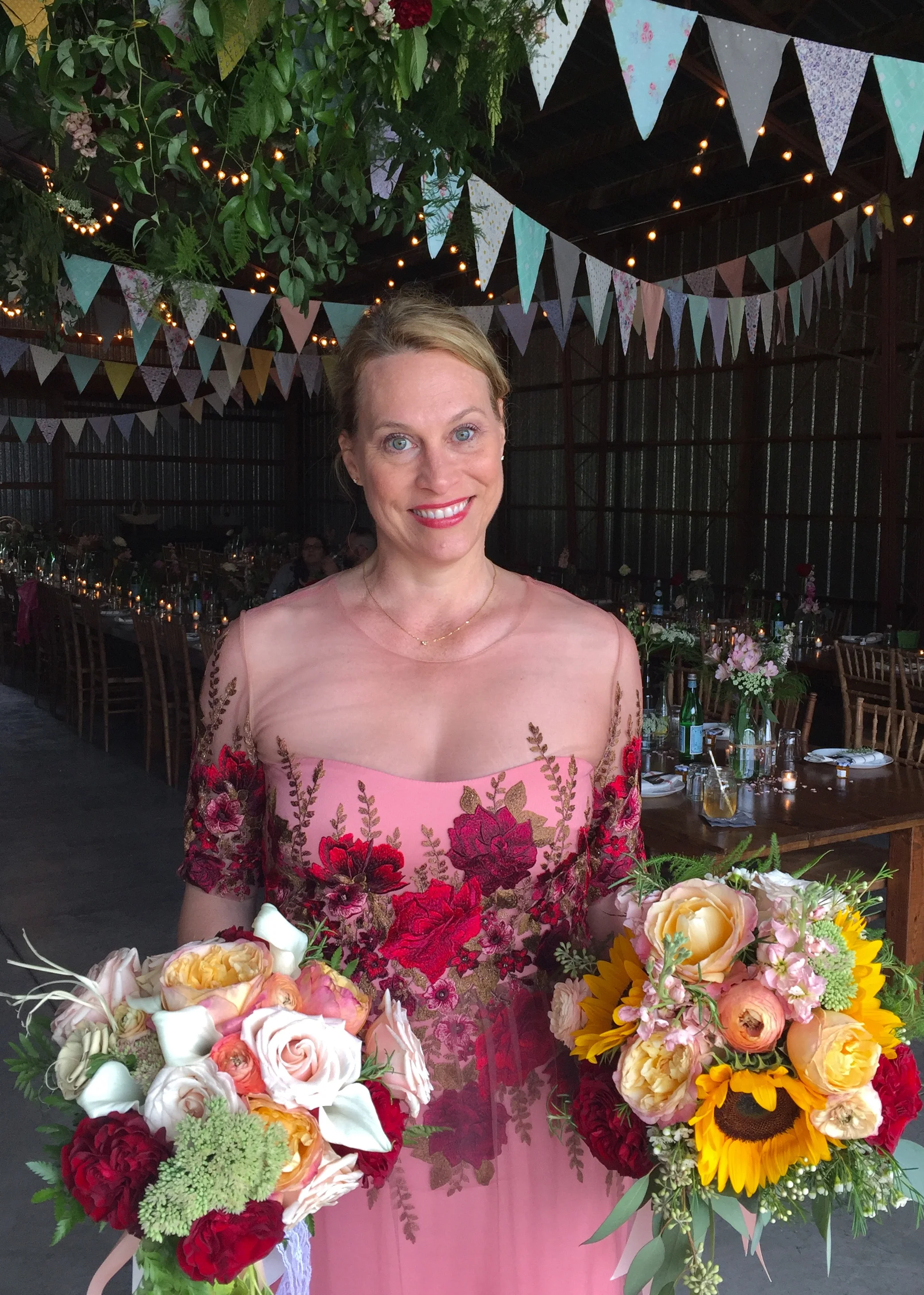 Two bridal bouquets and ready to celebrate. Photo by Nils Chittenden. Dress by Marchesa Notte.