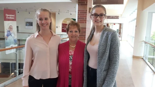 NHH board chair Beth Selby is seen with this year's NHH Health Professions Scholarship winners, Catharine Mead (left) and Madison Holmes