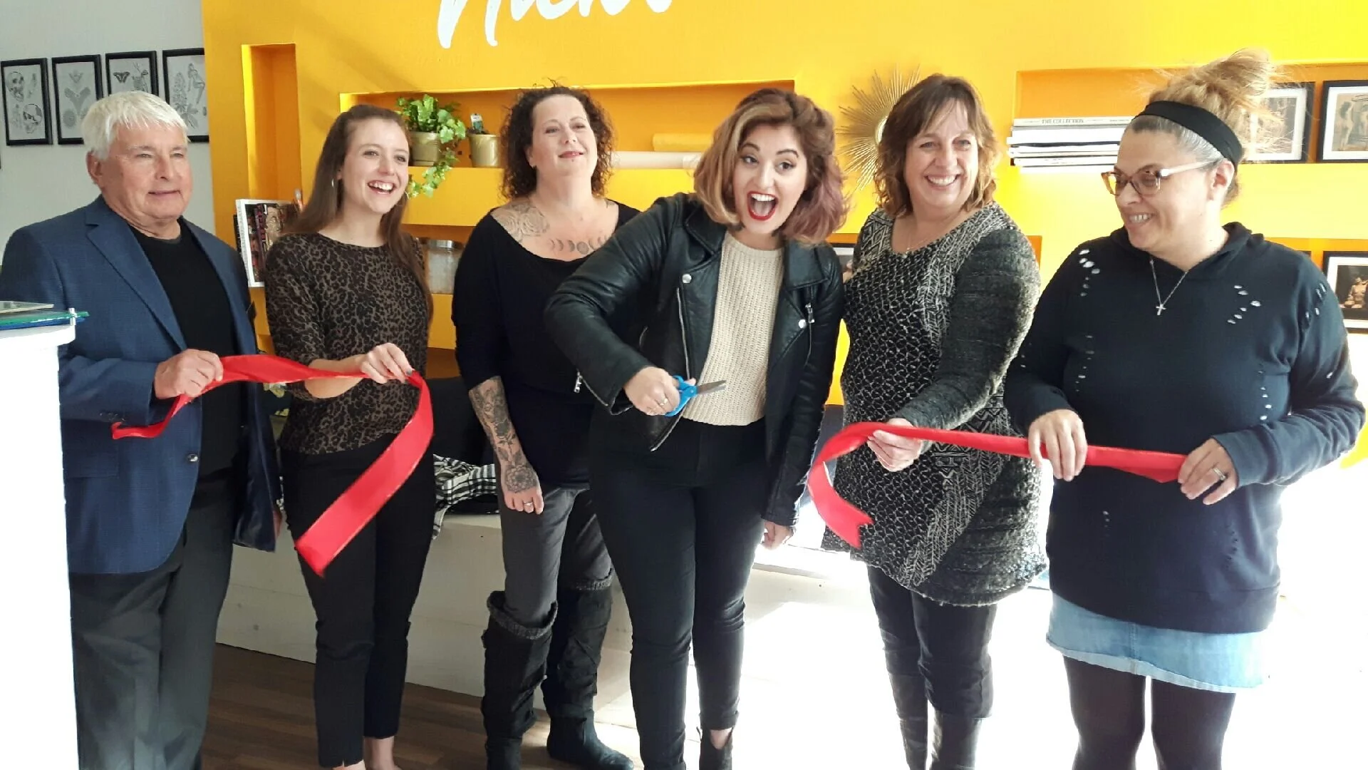 From left, Port Hope Deputy Mayor Les Andrews, MPP representative Paige Wiggins, Nick's staffer Gerry Barnes and owner Nickola Pandelides, HBIA manager Jamie Byers and Port Hope & District Chamber of Commerce representative Maria Papaidannoy-Duk cut the ribbon at Nick's grand opening Friday