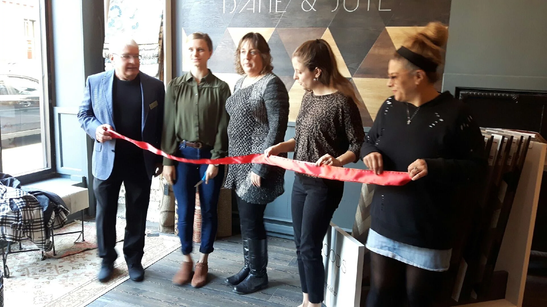 From left, Port Hope Deputy Mayor Les Andrews, Dane & Jute owner Jasmine Dickson, Heritage Business Improvement Area manager Jamie Byers, MPP representative Paige Wiggins and Port Hope & District Chamber of Commerce representative Maria Papaidannoy-Duk cut the ribbon at the business's grand opening