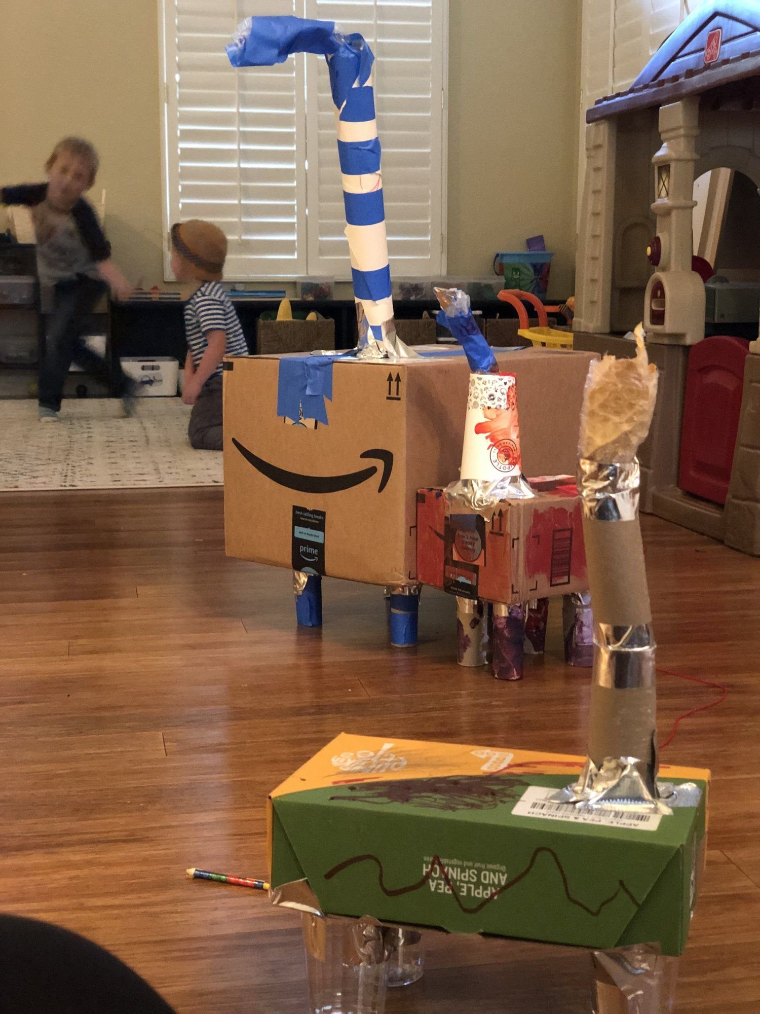 My boys made these “dinosaurs” out of old boxes, duct tape, toilet paper and paper towel holders, old cups, and plastic lining from packages