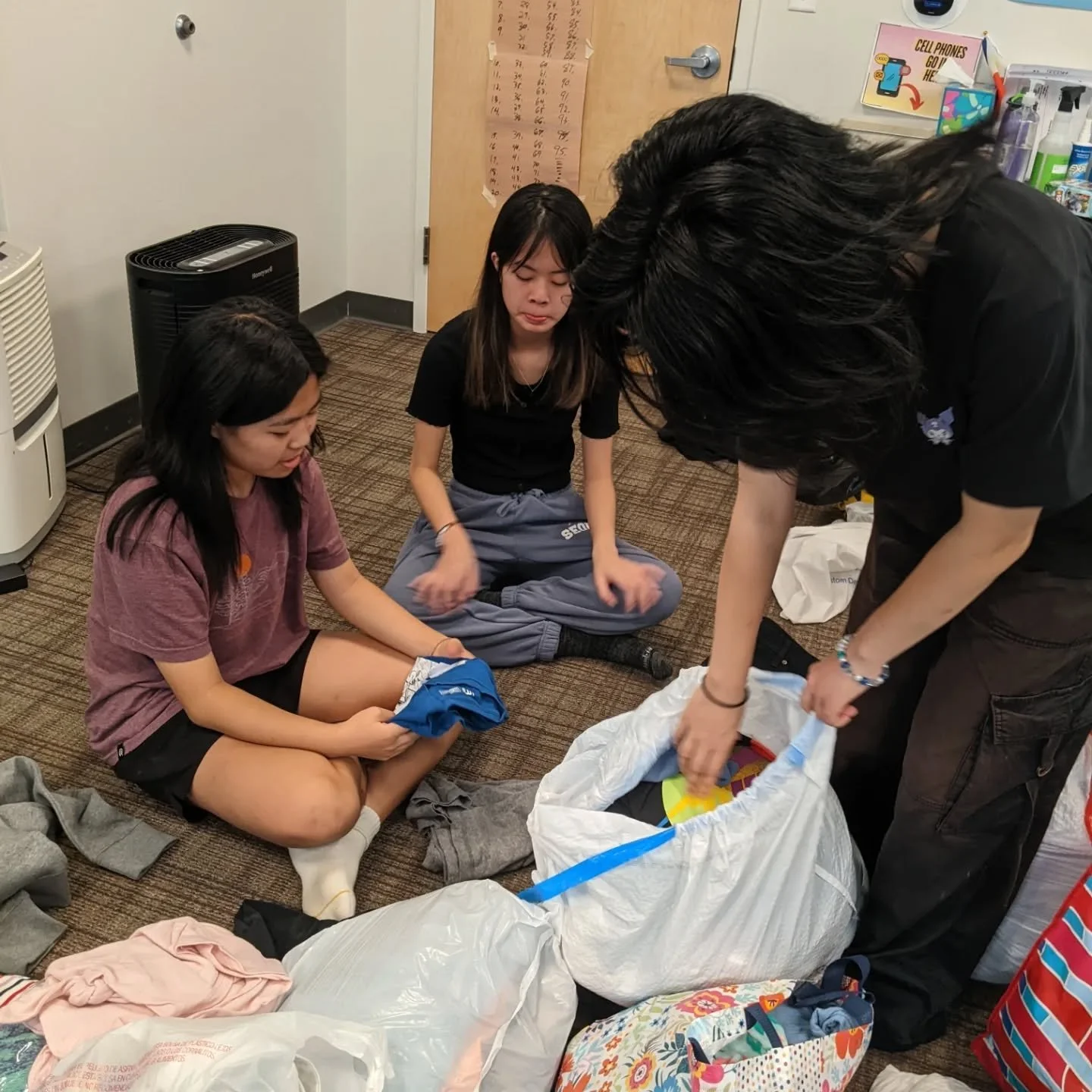 Sorting donations for the clothes and school supply giveaway