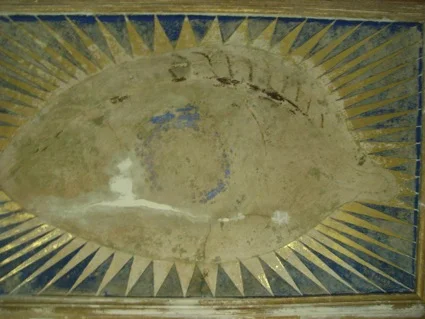 One of the eyes having been cleaned and conserved but prior to repainting 