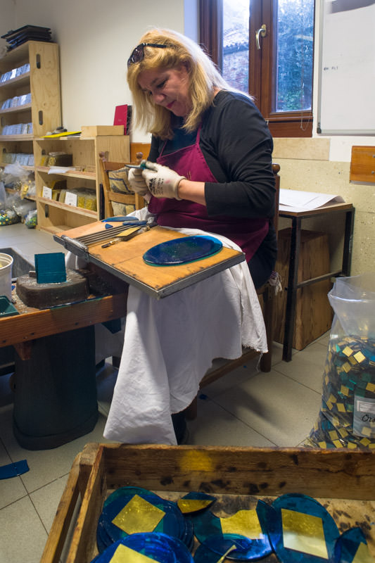 Cutting the mosaic tesserae by hand.