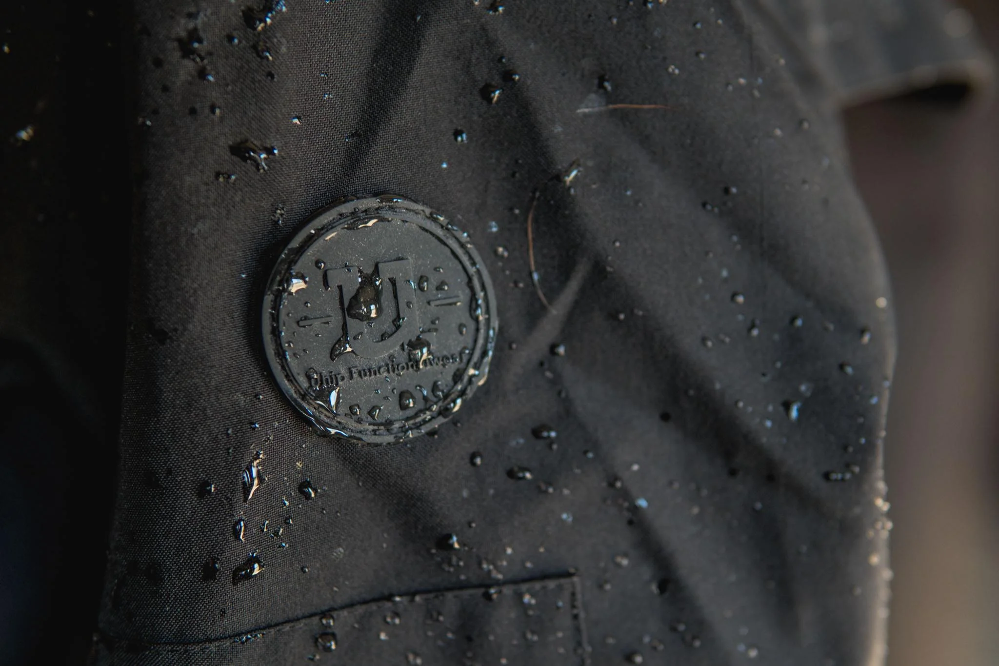 Uhip black mid length trench wet.jpg