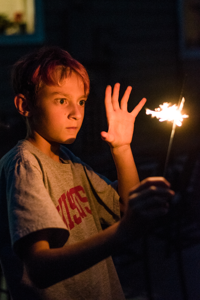Xander growing confidence with the sparkler. Sienna just screamed and dropped hers in the grass. I knew at that time watering the lawn ahead of time was the right choice.