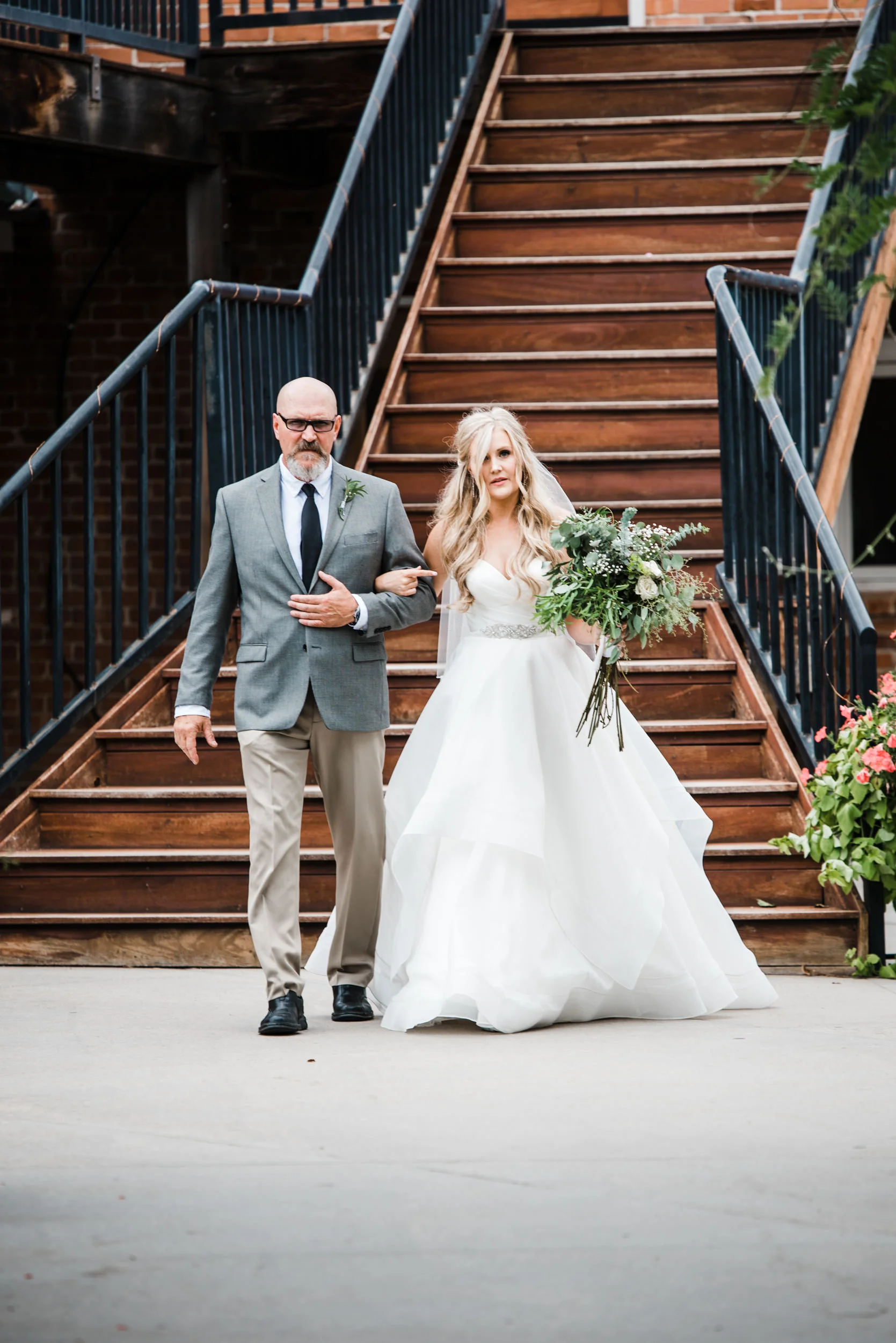 Colorado mountain wedding photographer at Brookeside Gardens father of the bride and bride headed down the aisle