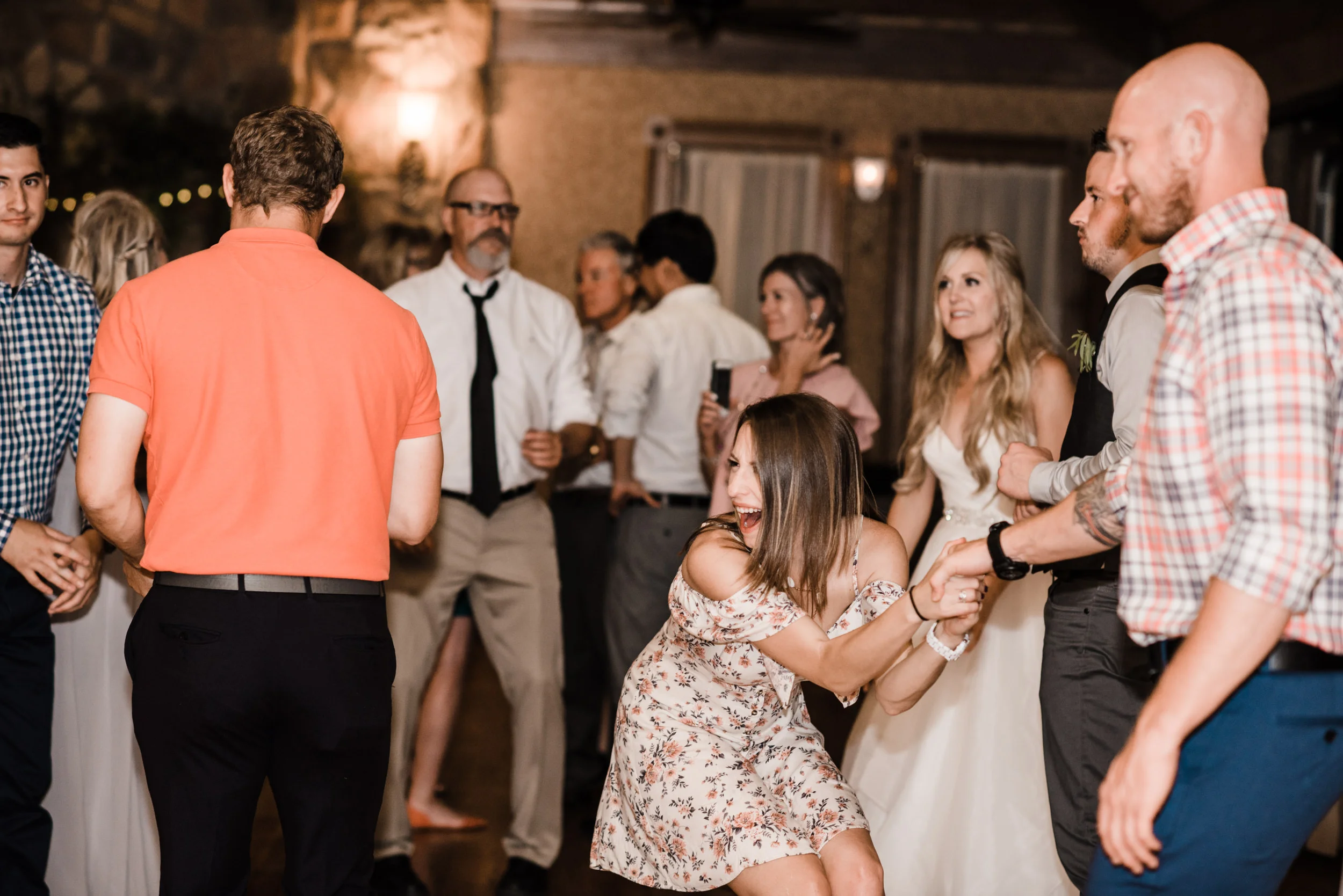 Colorado mountain wedding photographer at Brookeside Gardens wedding reception people dancing and having a good time