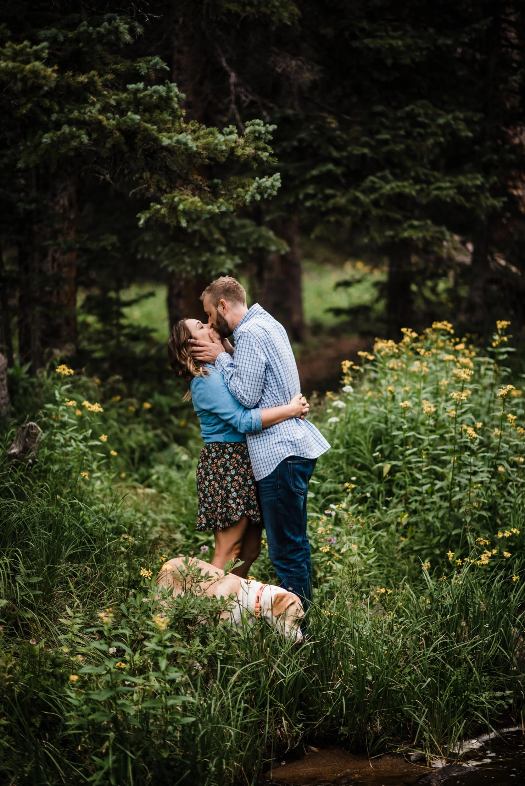 Indian Peaks-Brainard Lake-Colorado Engagement kiss in wildflower field
