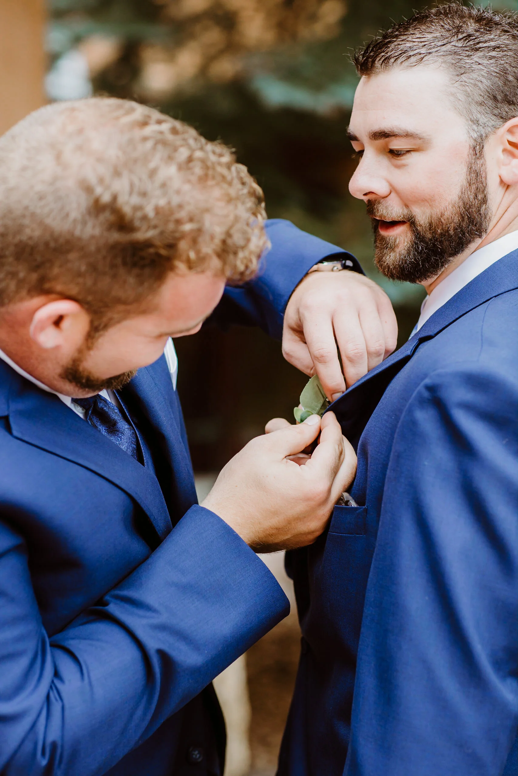 Groom and best man getting ready at Keystone, Colorado mountain wedding