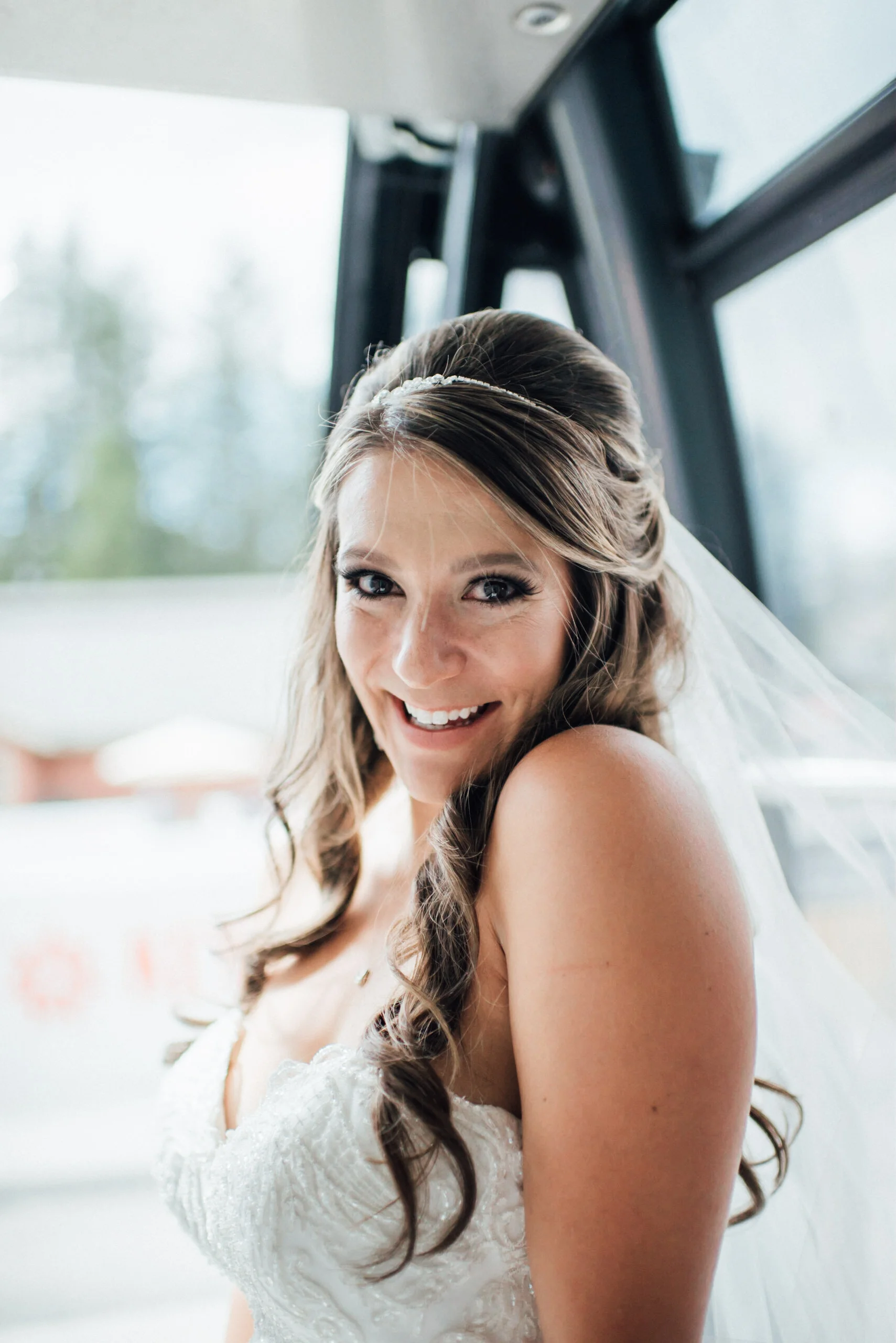 Bride on gondola at Keystone, Colorado mountain wedding