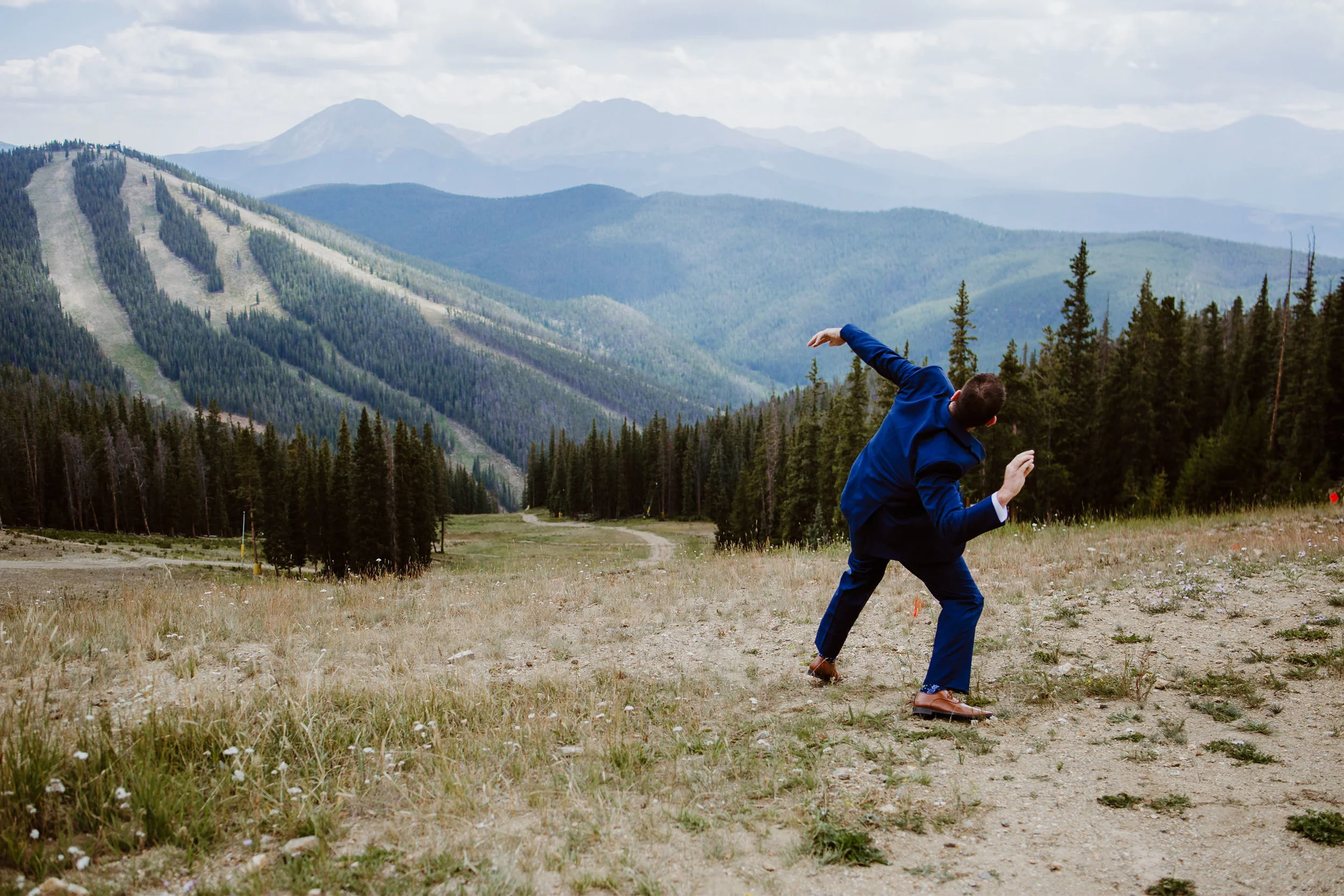 Groom at first look at Keystone, Colorado mountain wedding
