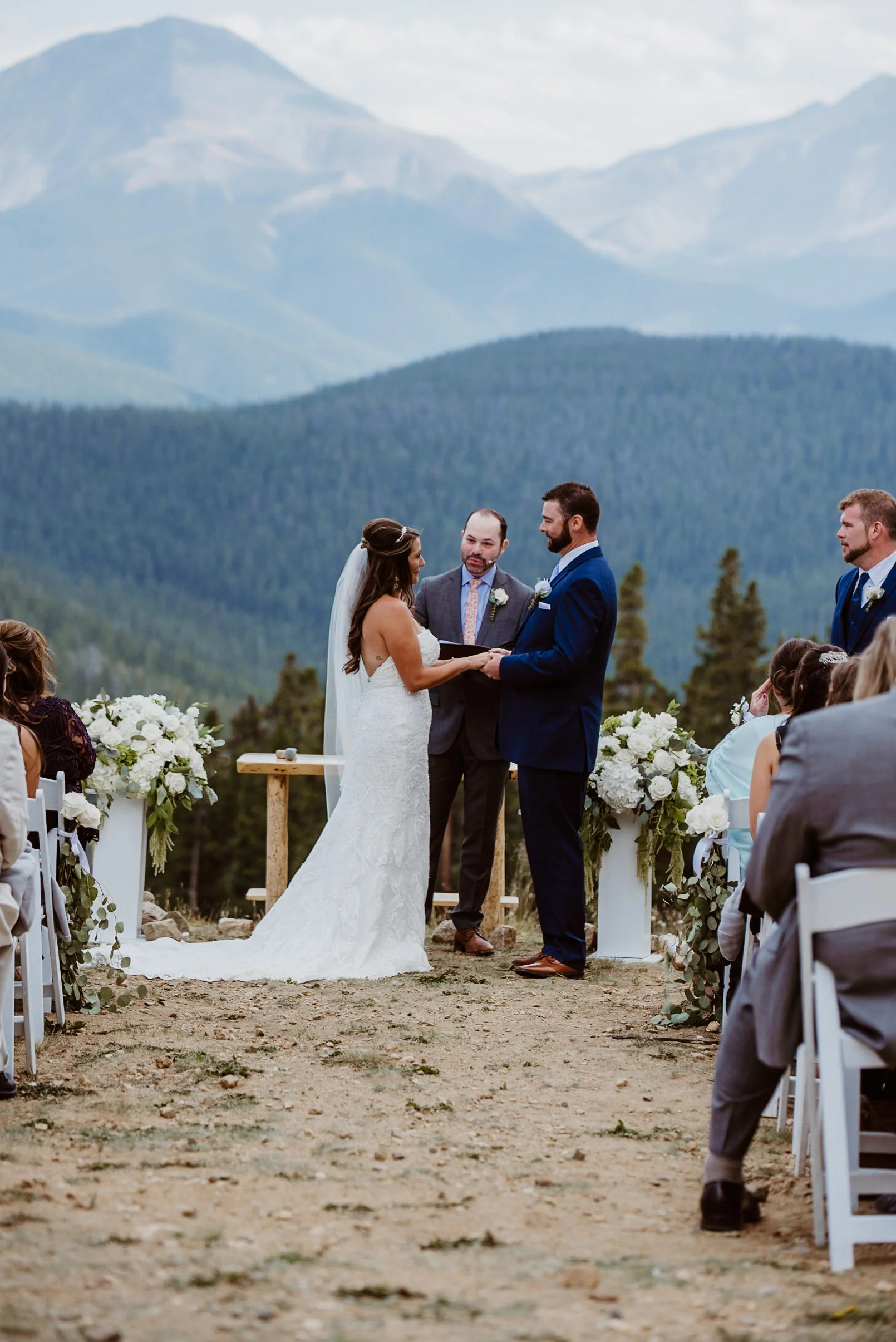 Bride and Groom at ceremony at TImber Ridge at Keystone, Colorado mountain wedding