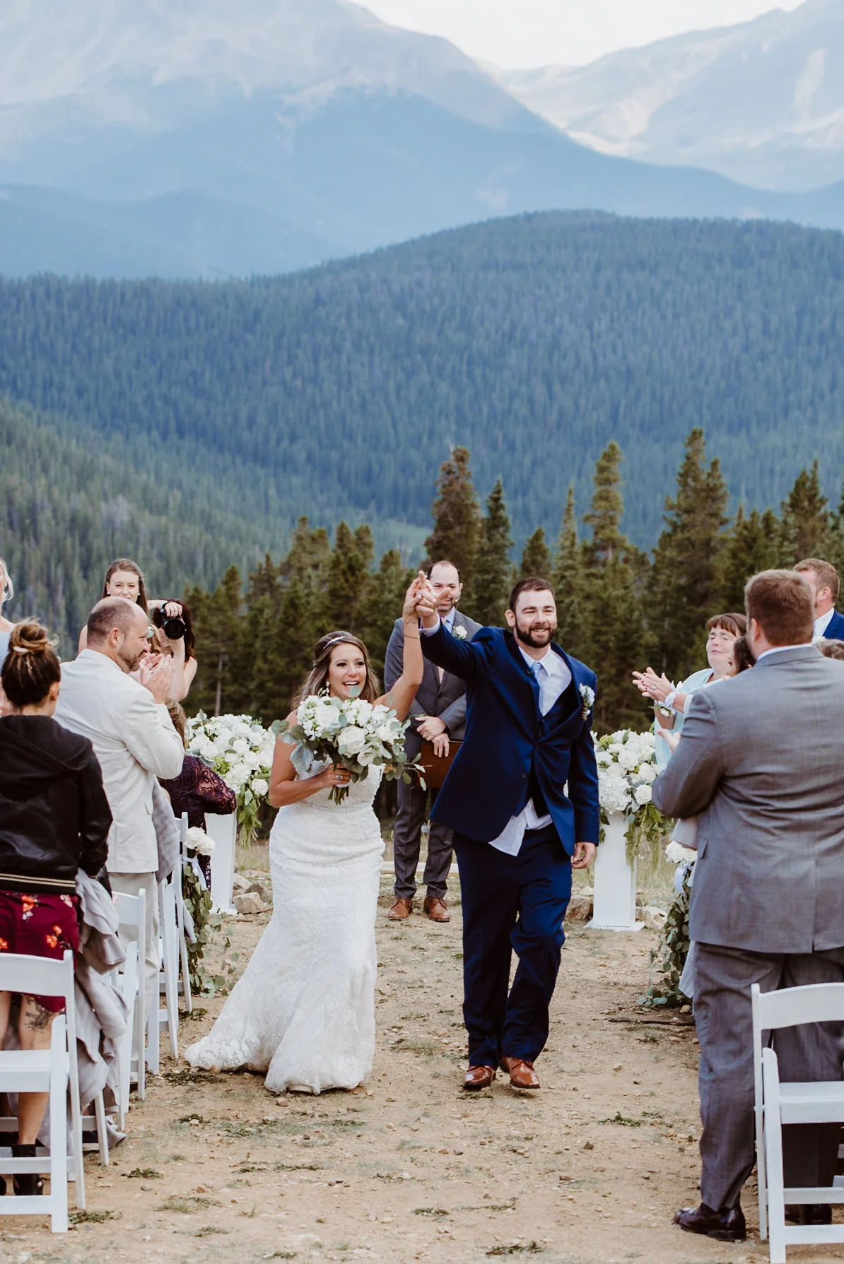 Bride and Groom at ceremony at TImber Ridge at Keystone, Colorado mountain wedding