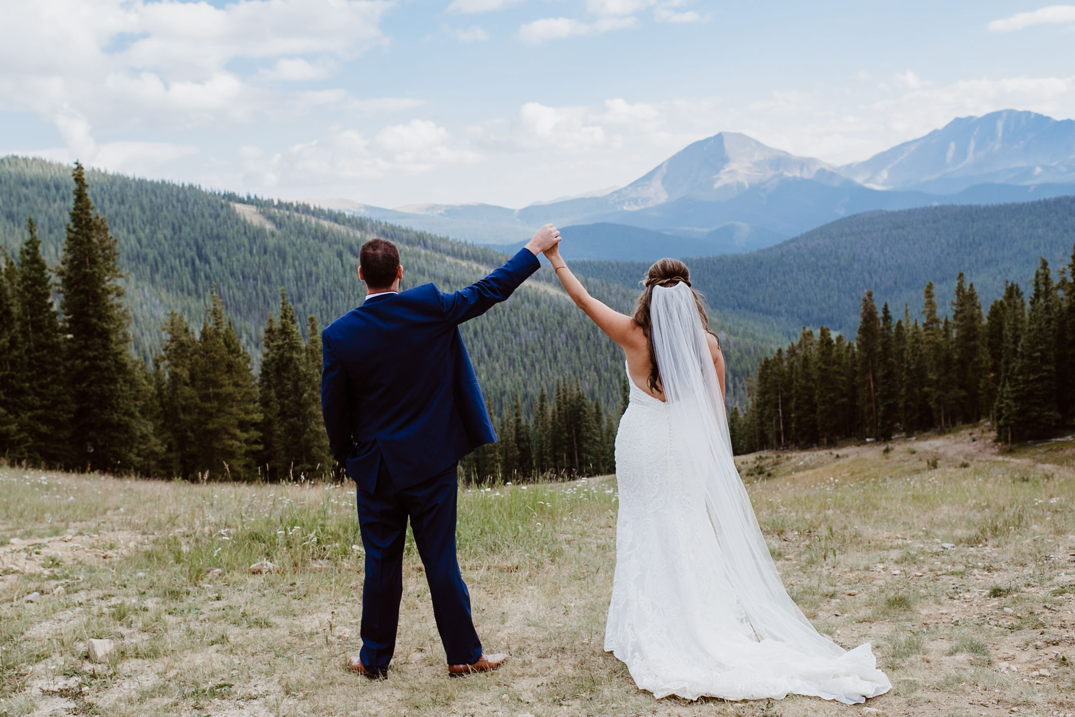 Bride and Groom at ceremony at TImber Ridge at Keystone, Colorado mountain wedding