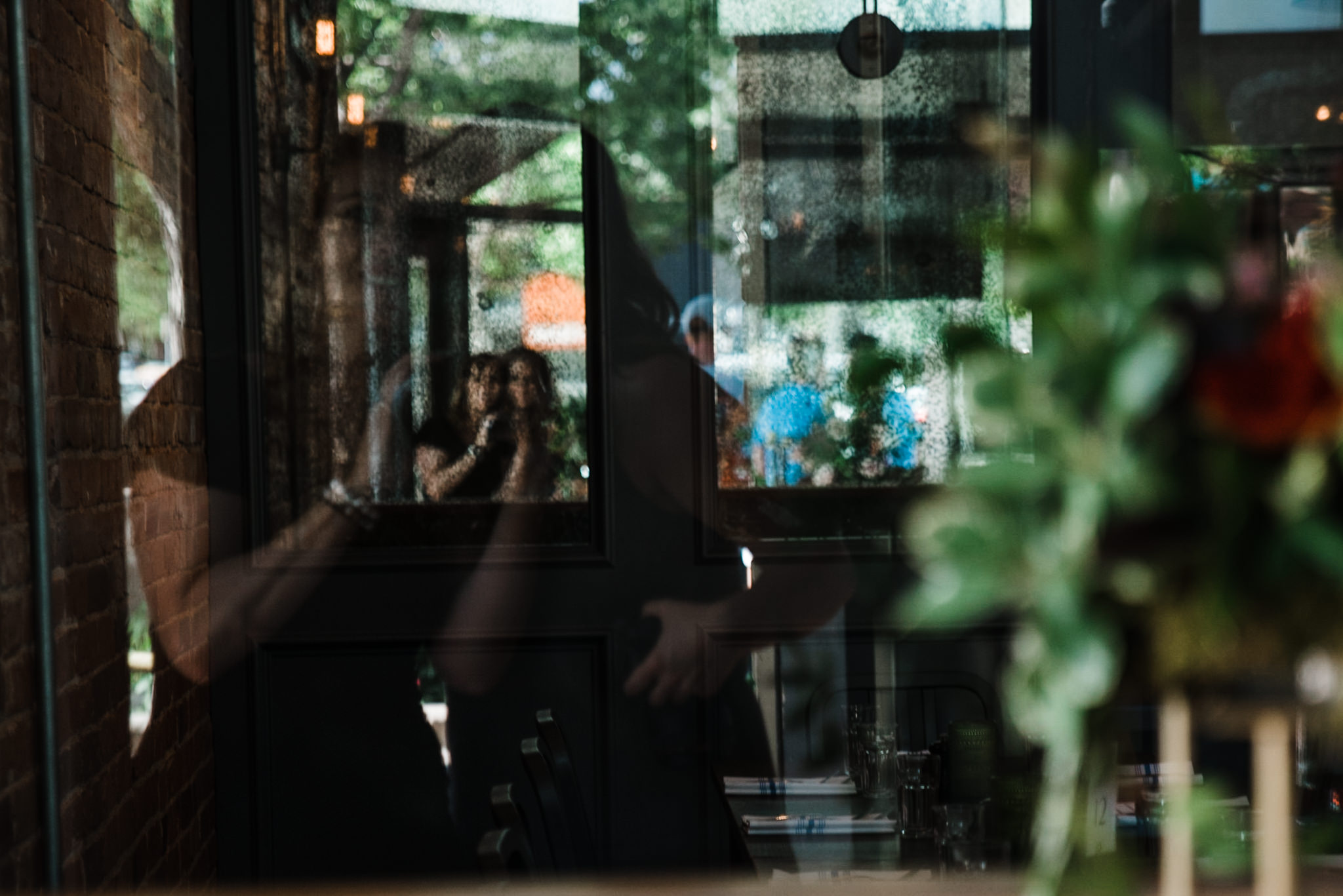 Heather and I made a thing of taking a photo of ourselves through a reflection at each wedding.