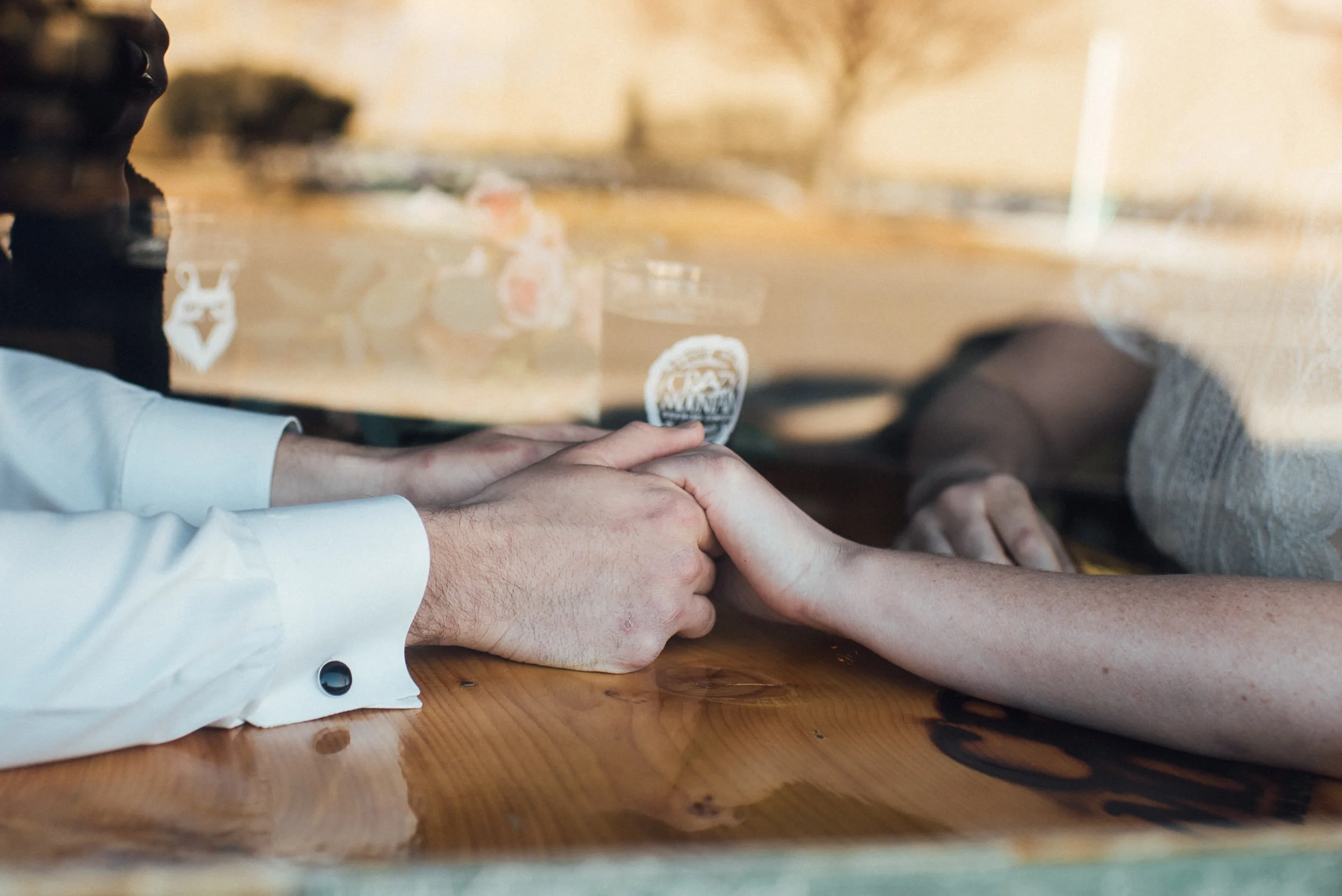 Wedding window reflection at Denver brewery with bride and groom-wedding photography