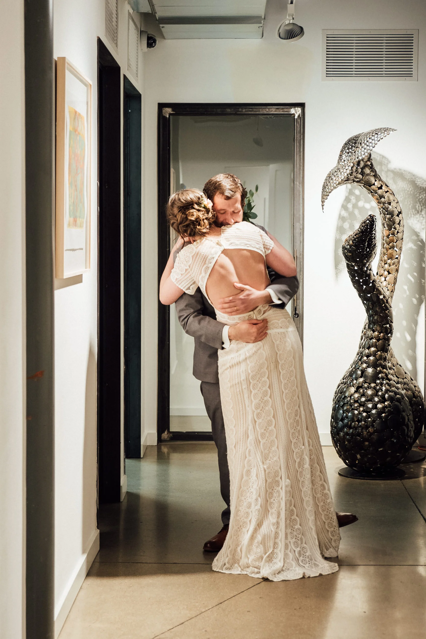 Emotions run high at the Space Gallery after wedding ceremony-Colorado Wedding Photographers