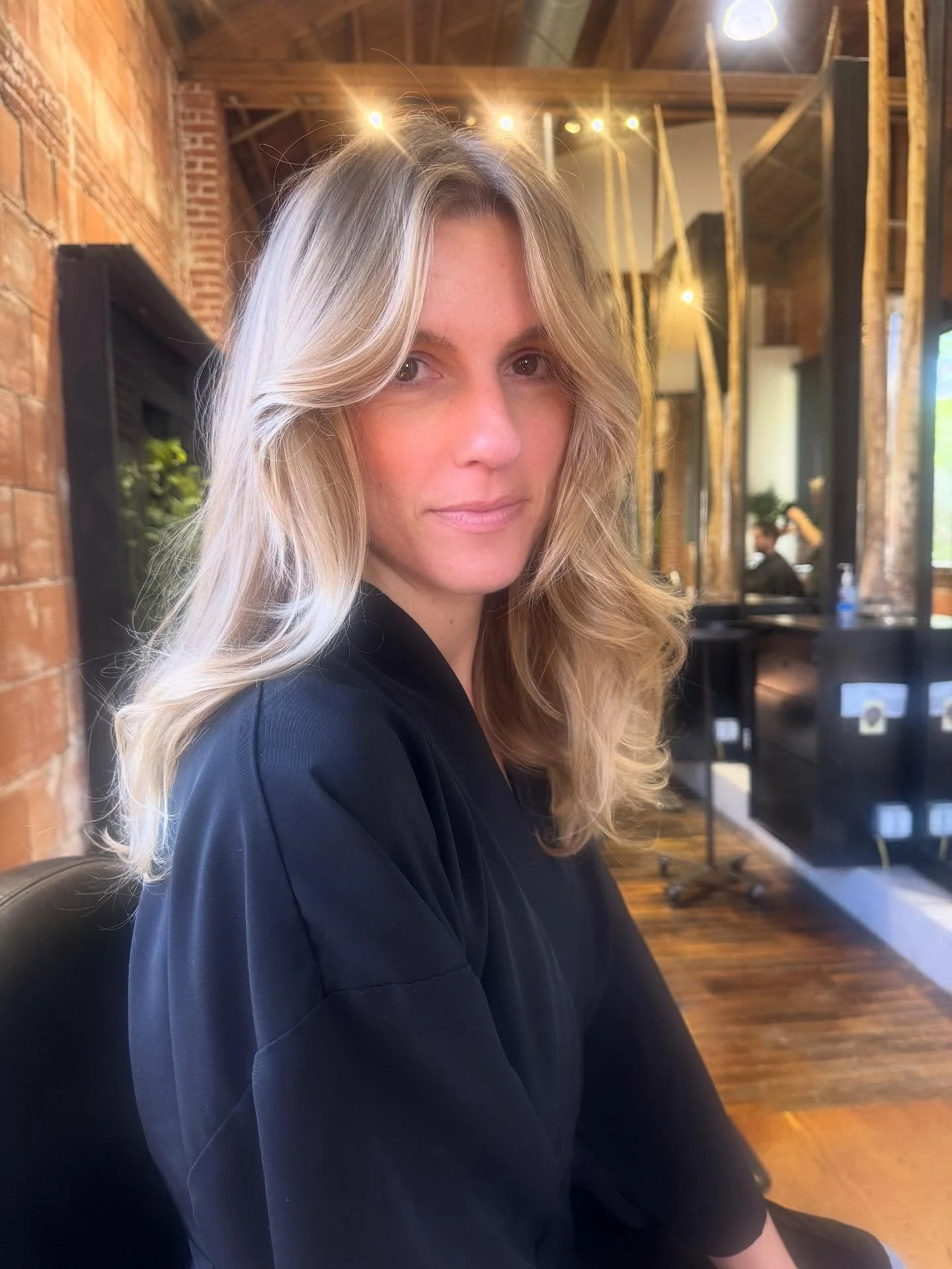 This GORGEOUS girl has been growing out her natural color for over a year now, she was feeling a little dark but didn&rsquo;t want to go back to bleaching. We did a full head of balayage using only high lift color! The transition from her virgin hair