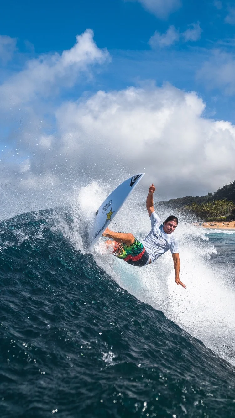 Reef McIntosh is a fearless surfer, determined to find a wave that can stand up to his impressive height. As a longtime member of the elite surfing community, Reef always manages to push the bar of what is possible even further. Reef began surfing in Kauai when he was only 4 years old and continued to grow his love for the sport, earning accolades and respect from his community for his dedication. Nicknamed “Big Cat,” it is no small wonder that Reef’s favorite places to surf include Pipeline (Hawaii), Cloudbreak (Fiji), and Zuma (California), all boasting some gnarly waves. Along with his love for challenge comes Reef’s passion for giving back and helping people with cystic fibrosis live longer lives. As a resident of the Quicksilver Pipeline House, Reef takes great pride in sharing what he’s learned from surfing all over the world with other surfers and giving back to his community.