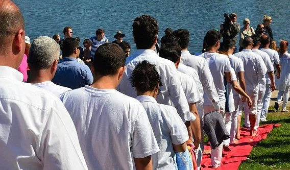 Refugees lining up for baptism