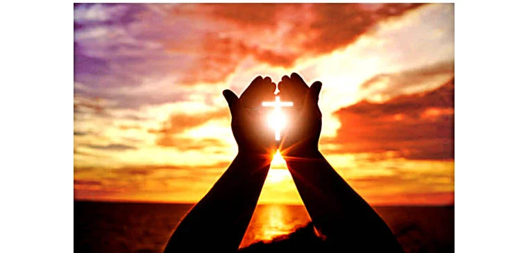 hands at sunset w cross w padding.jpg