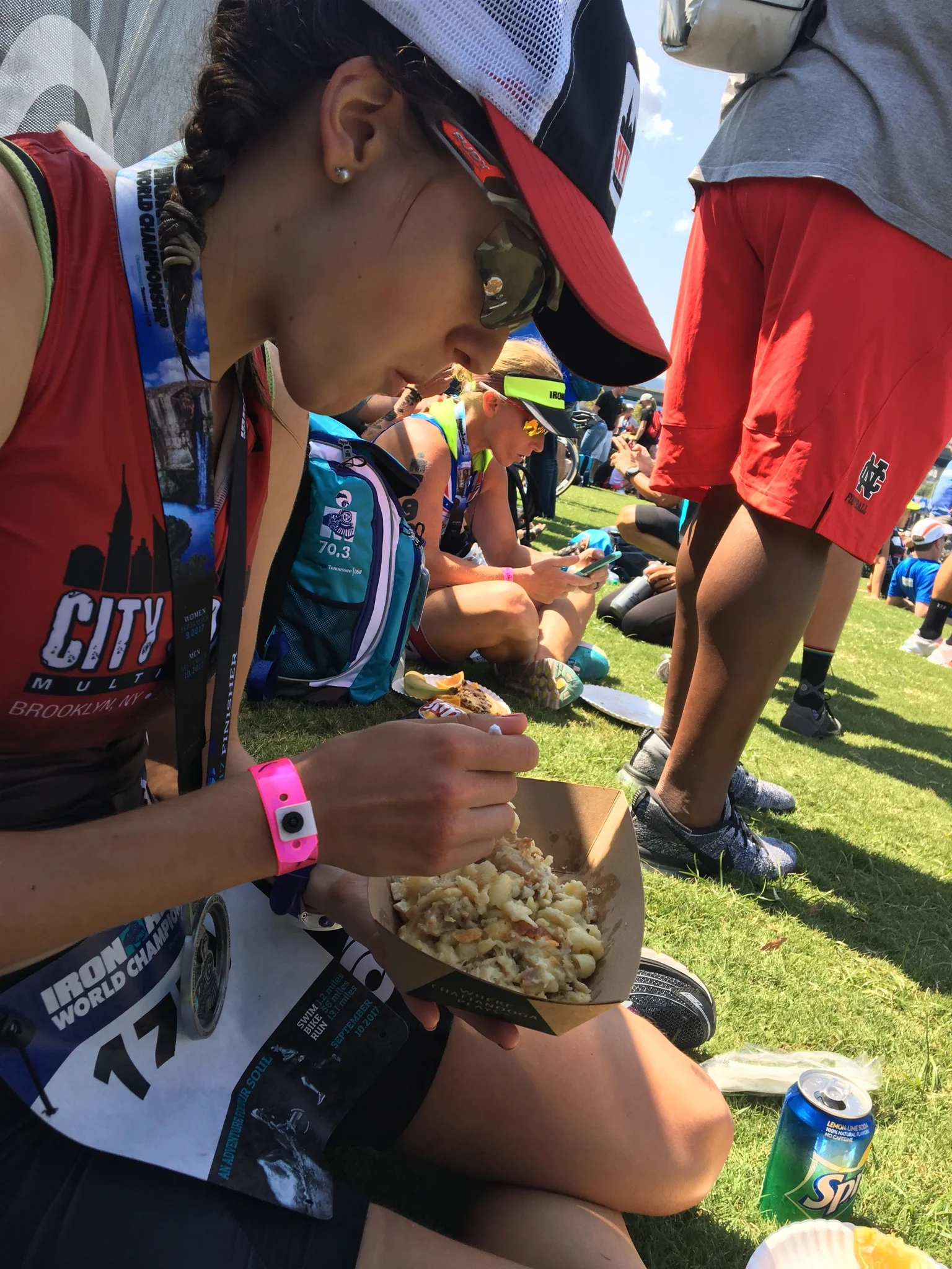 Covered in Gatorade, water-logged, sweat, an athlete eating. Photo credit: Gerry