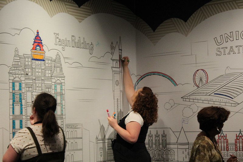  Folks color and add their own artistic touches to artist Rori’s illustrations on the walls of the ColoringSTL exhibit at Missouri History Museum. Photo Courtesy Missouri History Museum. 