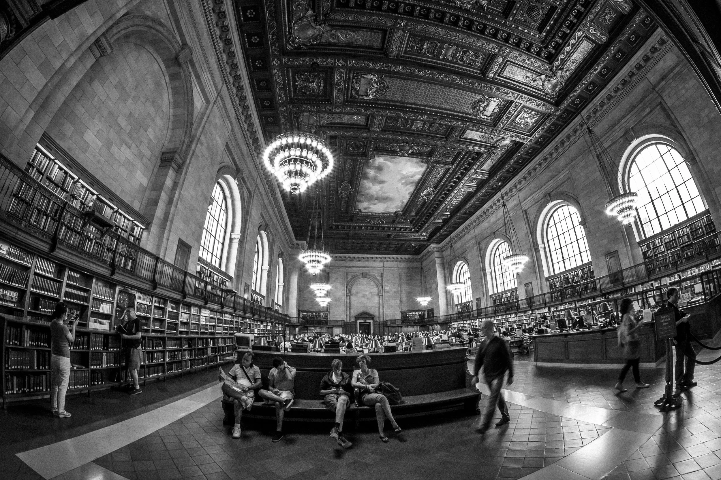 Visitors to a branch of the New York Public Library in a reading room. 