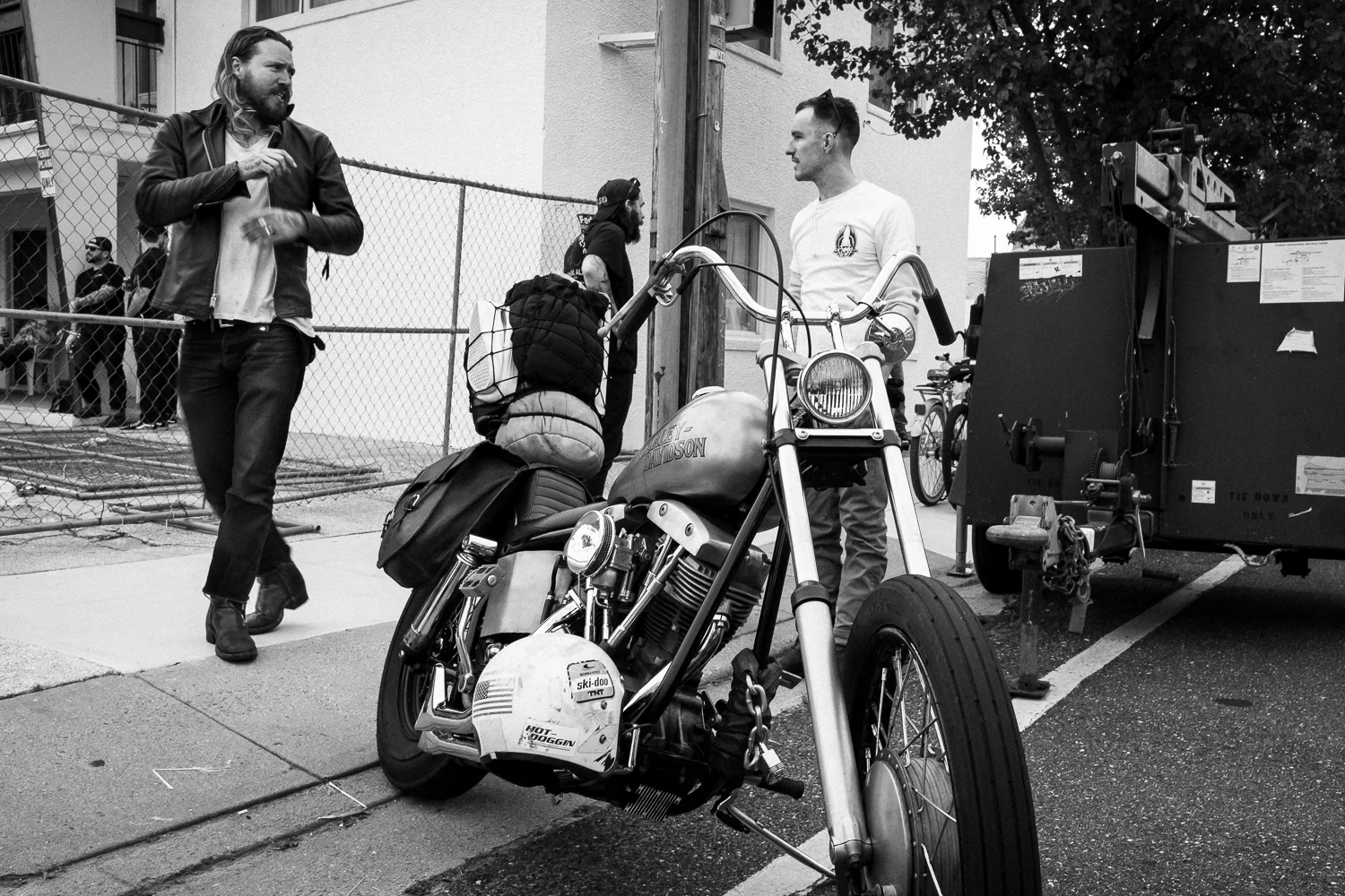 Bikers with a Harley Davidson chopper at The Night of the Troglodytes before The Race of Gentlemen gets started.