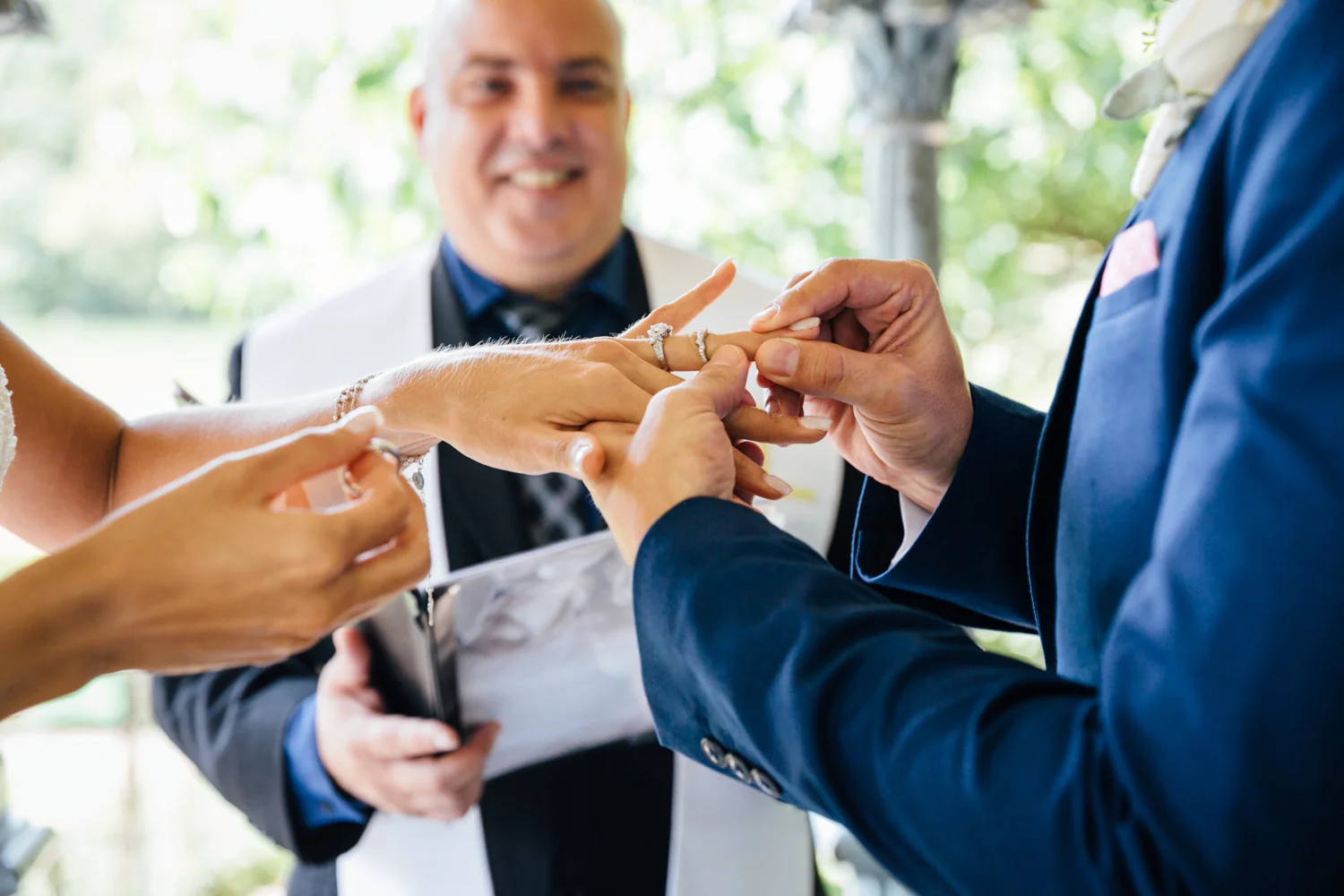close-up exchanging rings during a Ladies Pavilion wedding ceremony