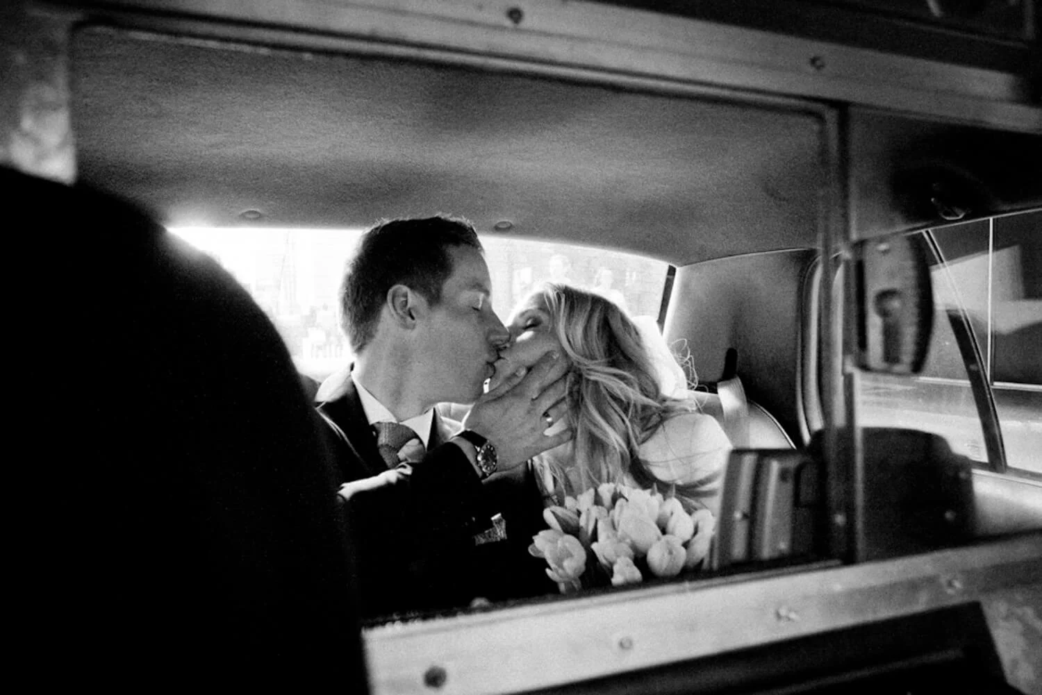 black and white wedding photo in new york city taxi