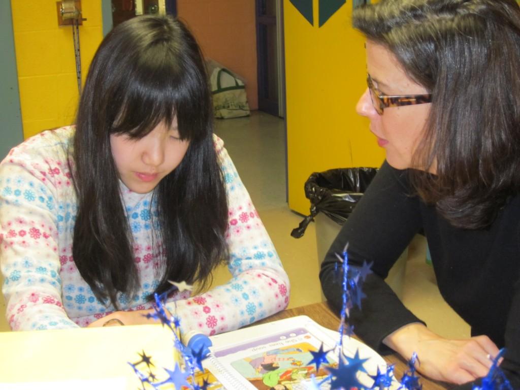 ELL teacher, Deidre, works with a 5th grade student from Japan