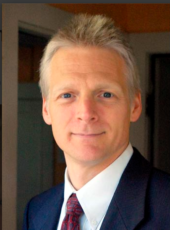 Who is James Bacon, town justice in New Paltz?