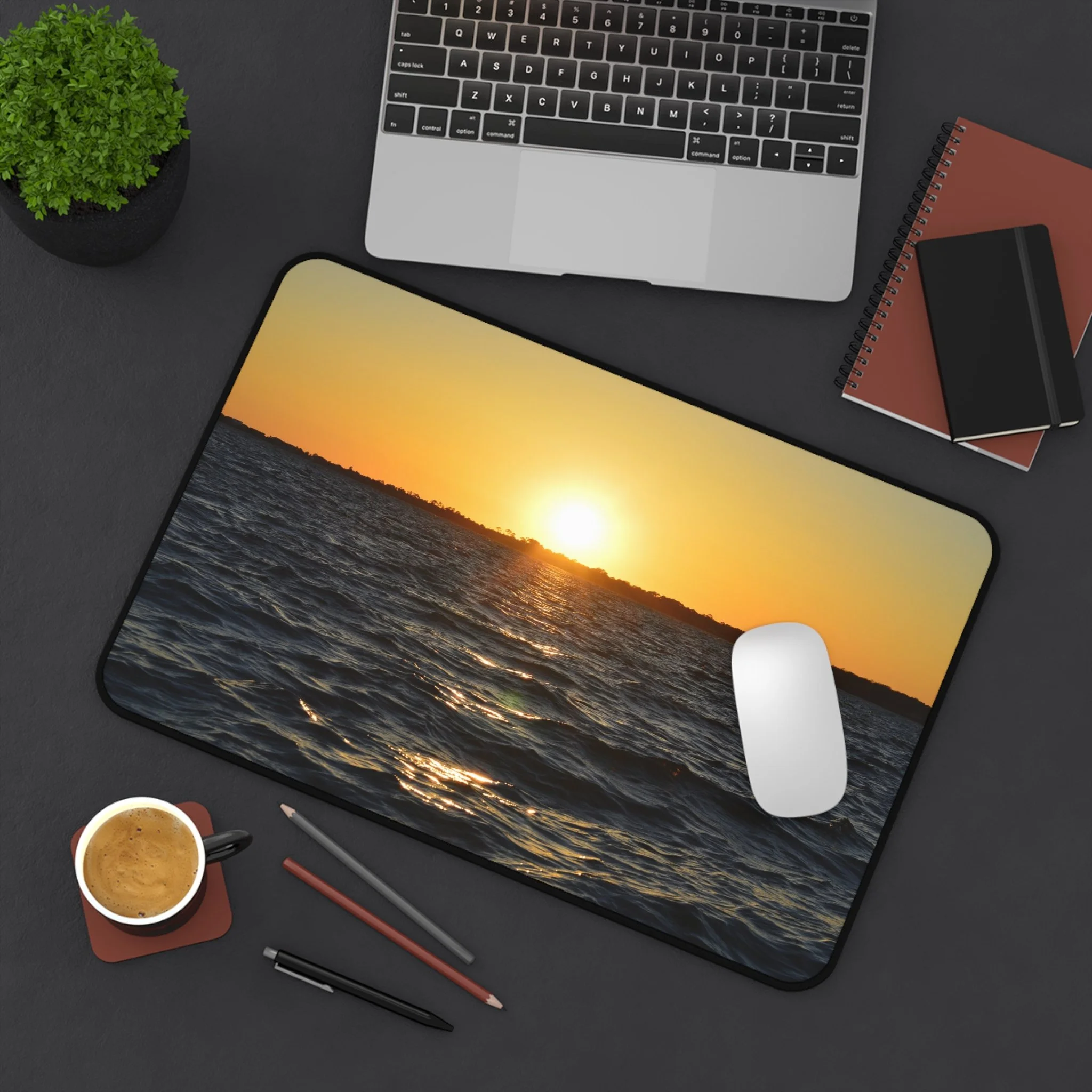 "Sunset over calm ocean waves, golden light reflecting on water — printed on a high-quality desk mat from The Abyss Collection"
