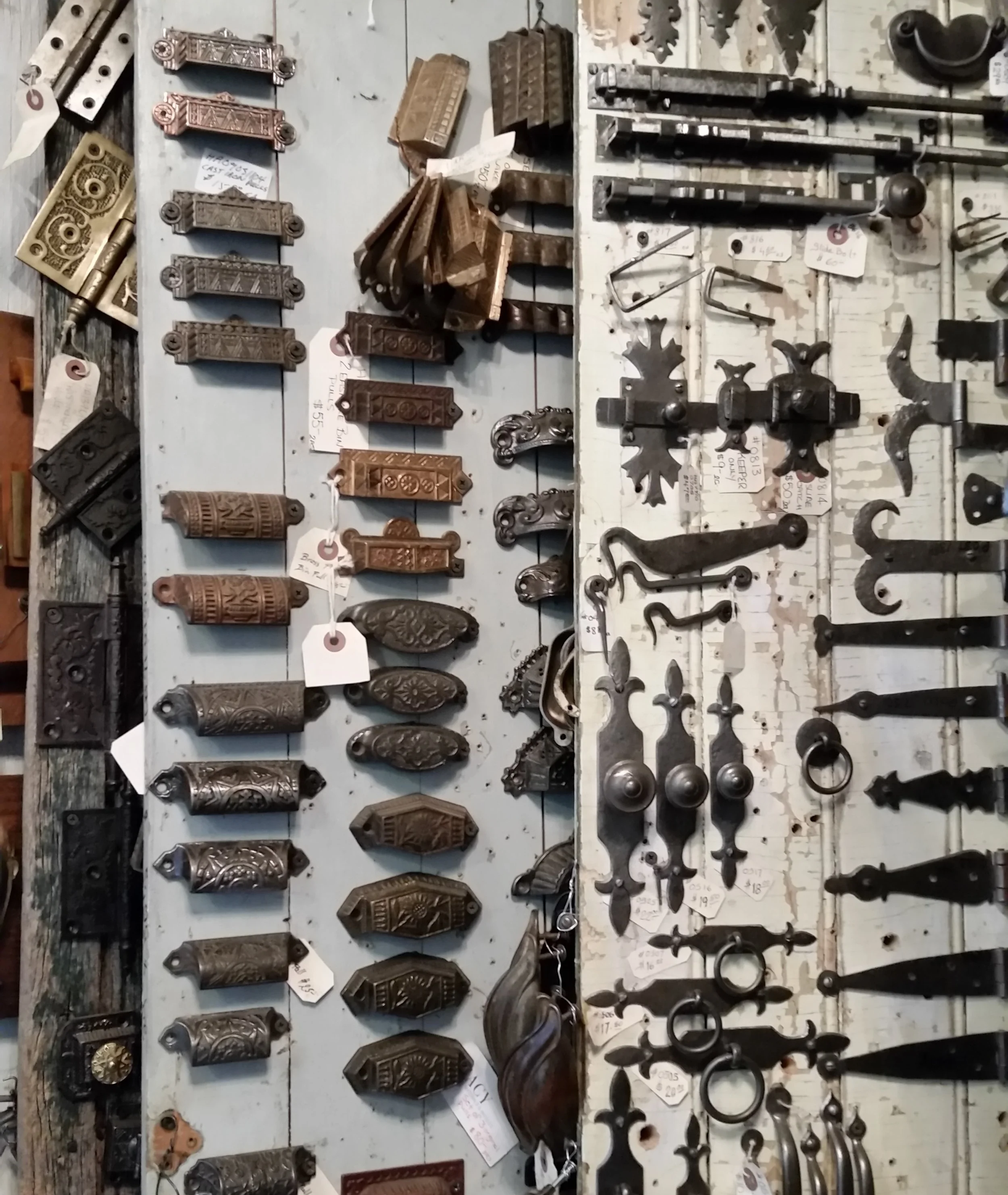 Some of the antique drawer pulls, latches, knobs and hinges.