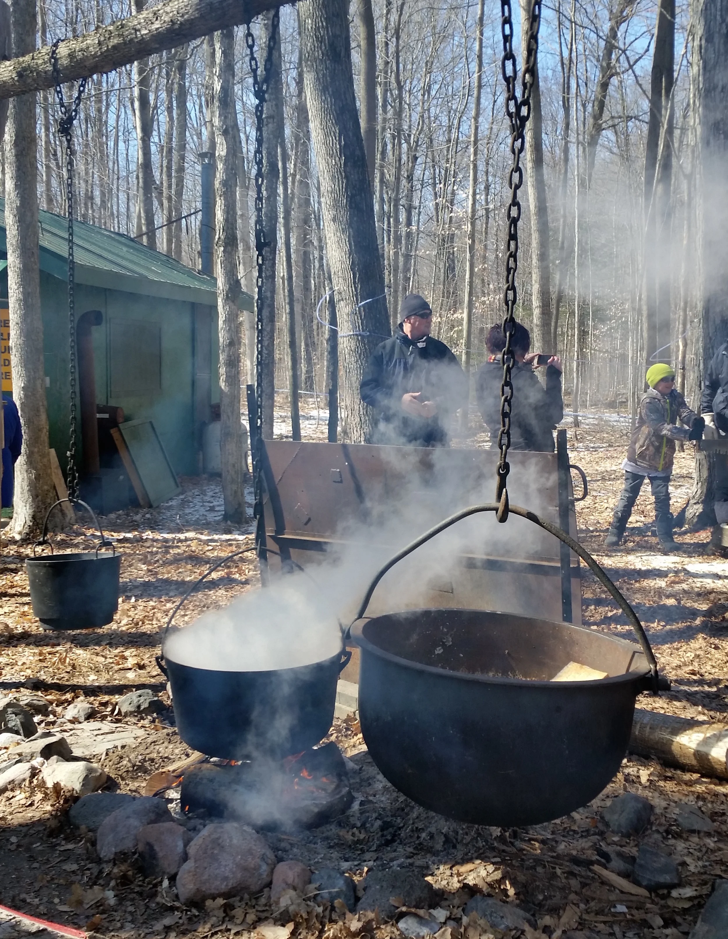 Boiling maple sap over an open fire.