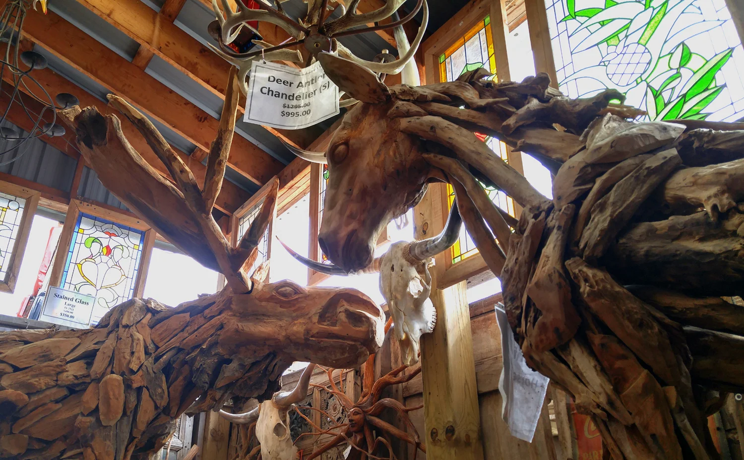 A life-size moose and horse, handmade from driftwood.