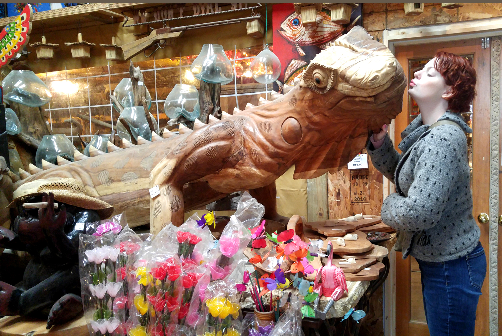 Sarah with her new friend, a 15 foot long hand-carved lizard.