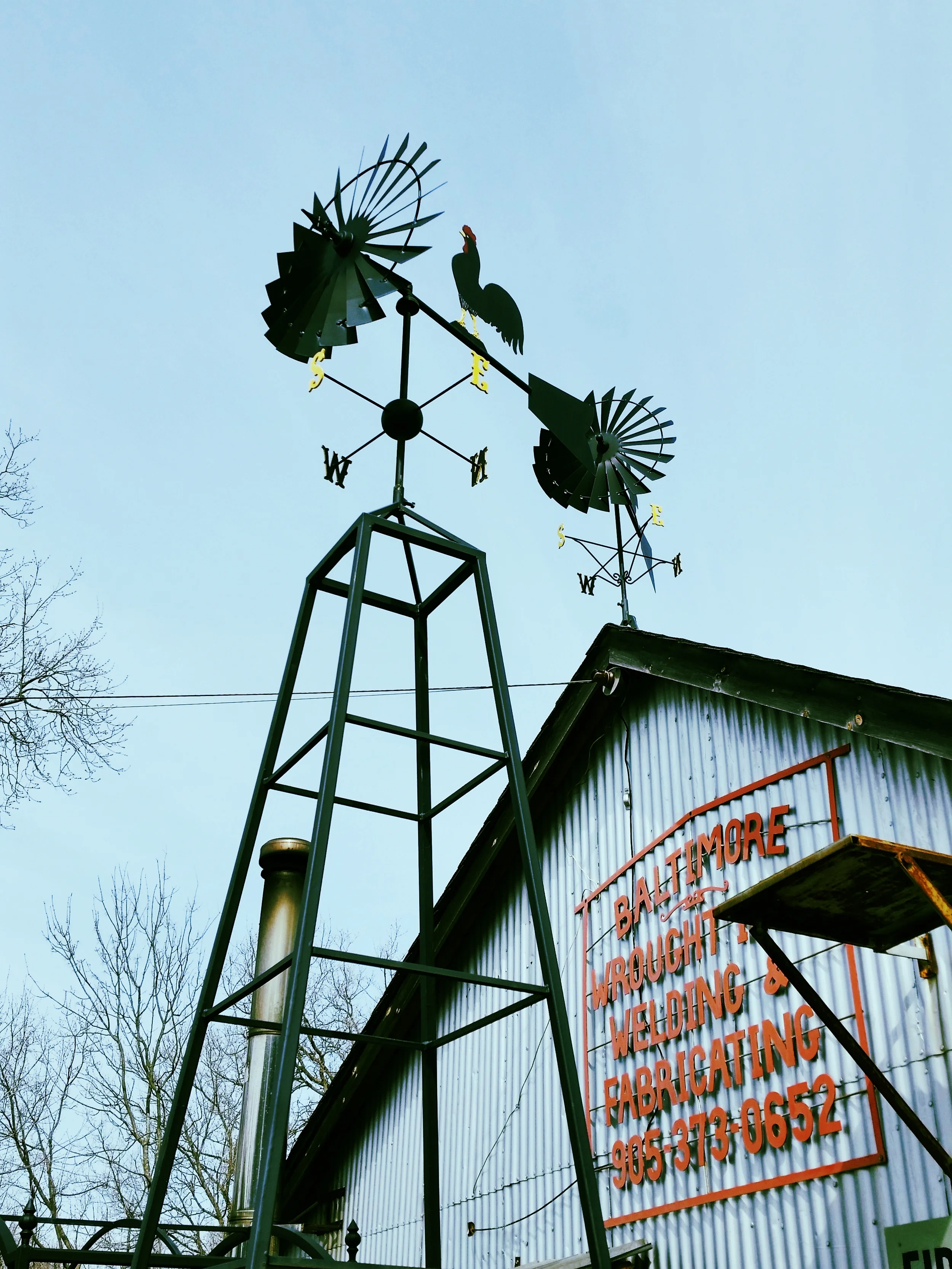 A Rooster wrought iron weathervane.