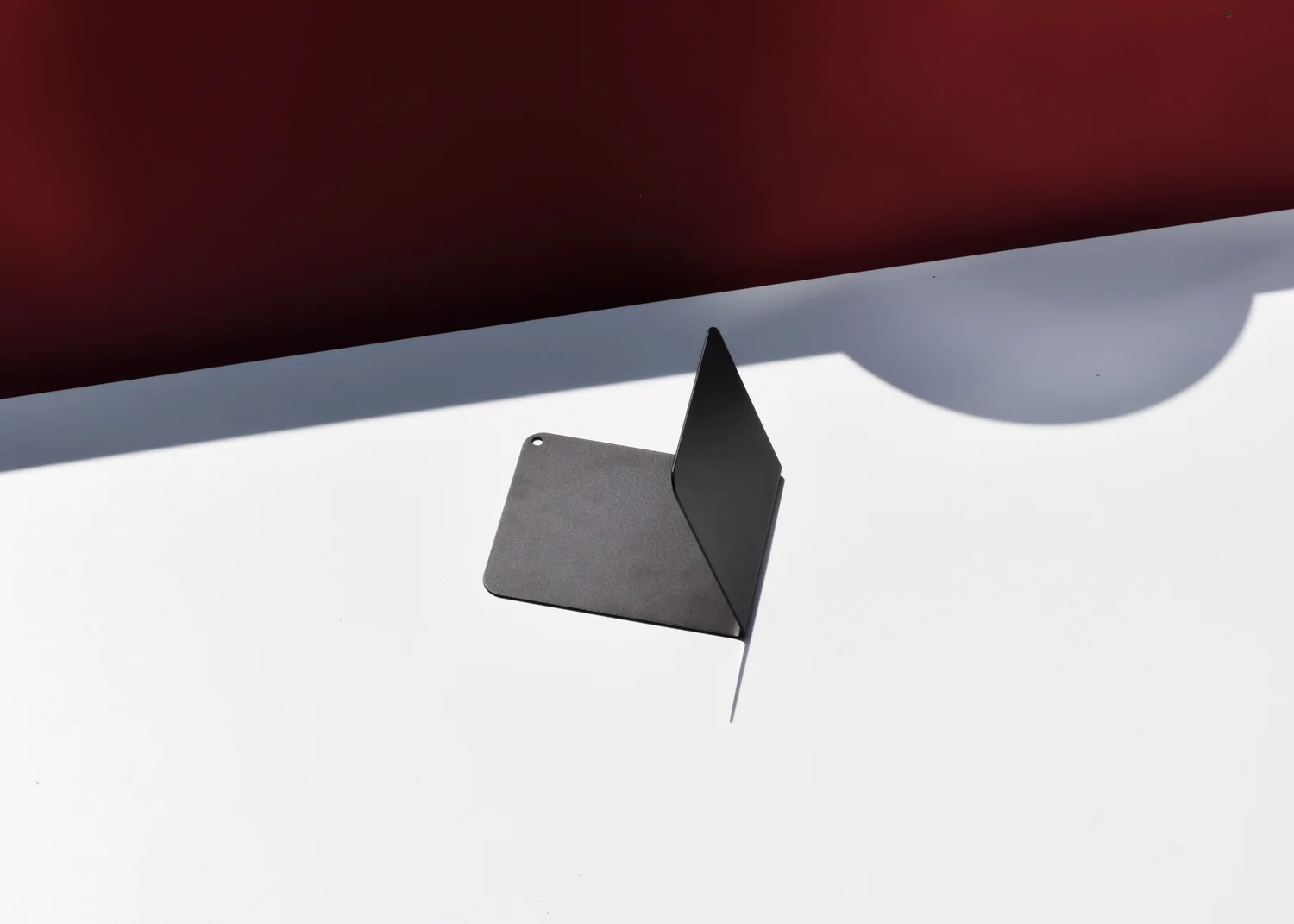 The Angled Bookend in black from product design brand This That.