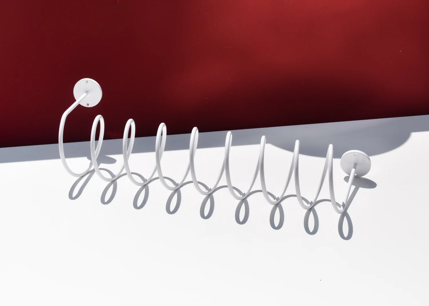 The Corkscrew Wall Hook from This That in white.