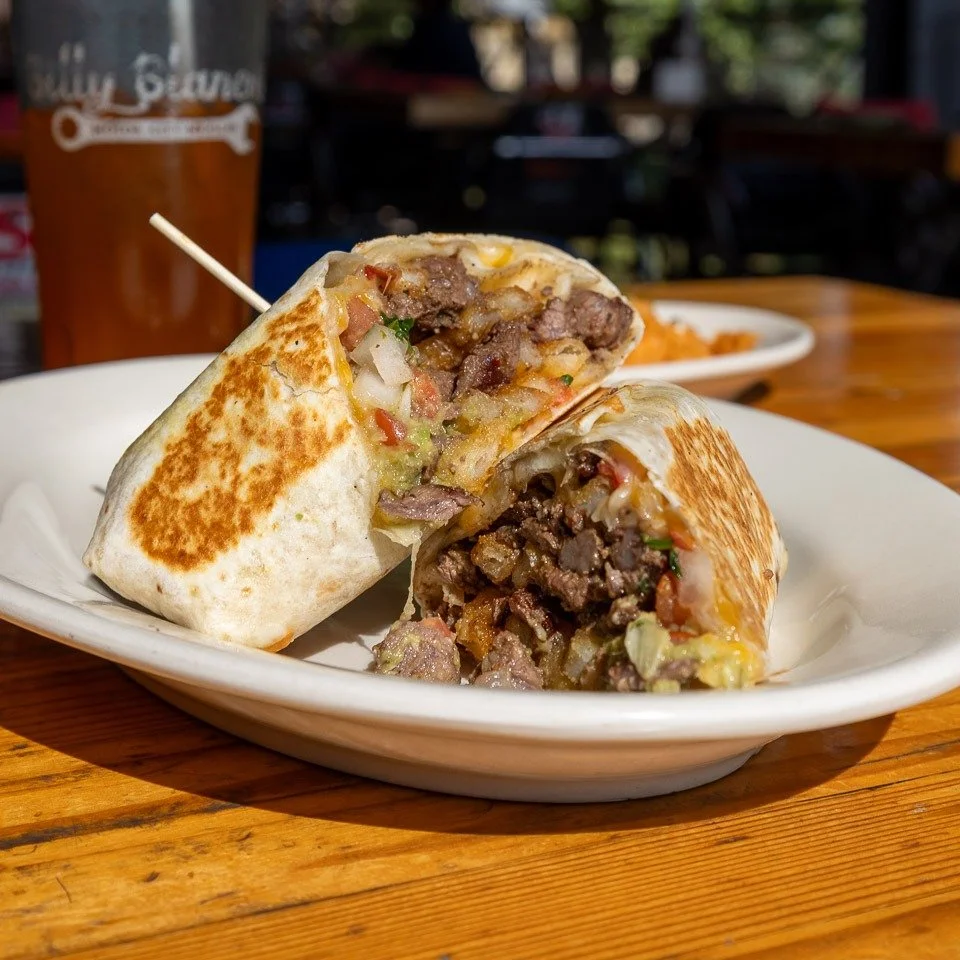 Behold, the Cali Burrito, made with carne asada, guacamole, pico de gallo, shredded jack and cheddar cheese in a flour tortilla, served California style with French fries inside. #parkcityfood