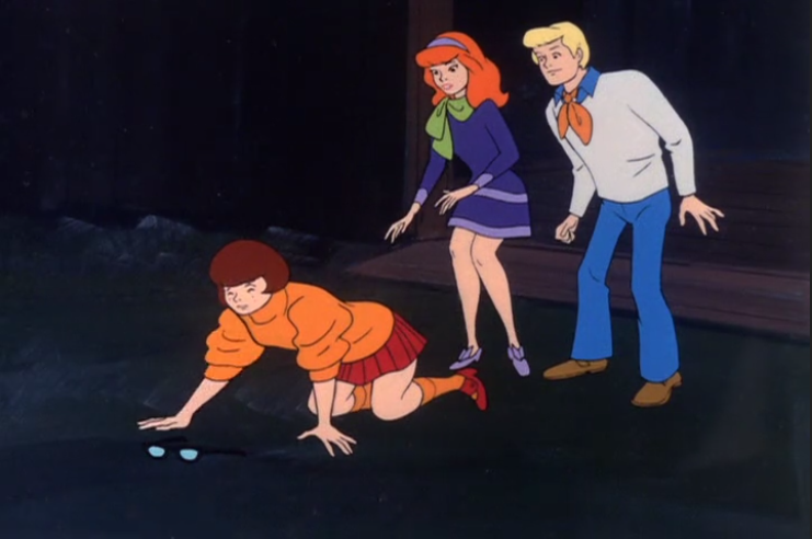  Fred: "To the left, Velma. No, you've missed them again."  Velma: "Could you just pick them up for me?"  Daphne: "They're right there, Velma. Right by the cow manure." 